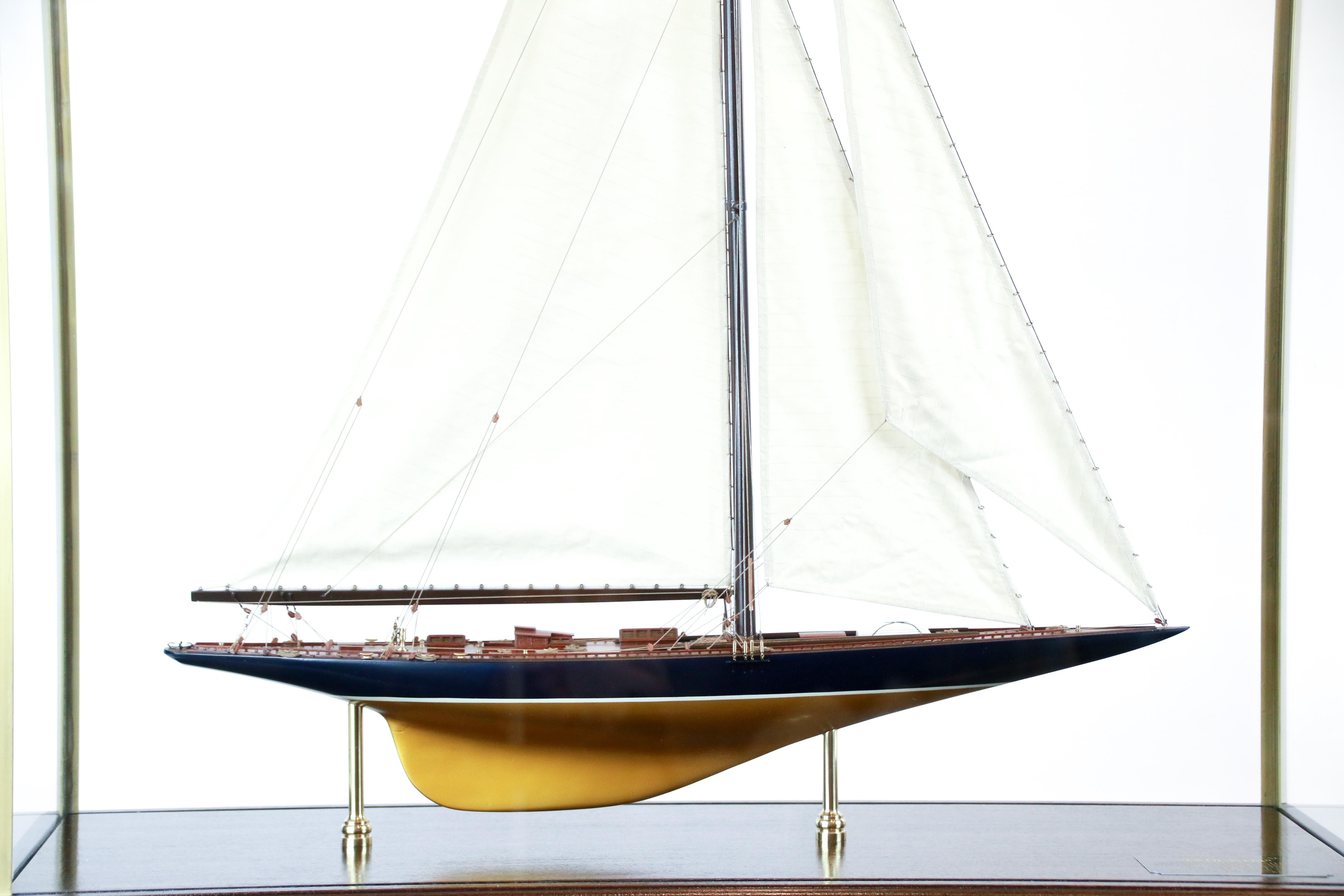 America's Cup model of the British challenger yacht Endeavour of 1934. She was built by Camper and Nicholson for aviator and yachtsman Tom Sopwith and raced against the New York Yacht club defender Rainbow.
The navy and gold model is detailed with