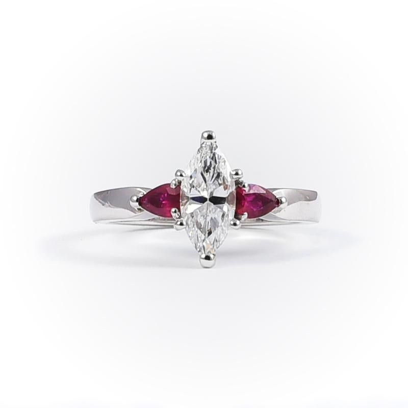 Elegant 18k white gold engagement ring with 1 diamond navette cut 1.01 carats and 2 rubies 0.38 carats