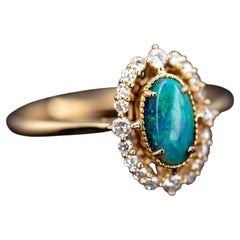 Engagement Ring: Australian Black Opal and Diamond in 18K Yellow Gold