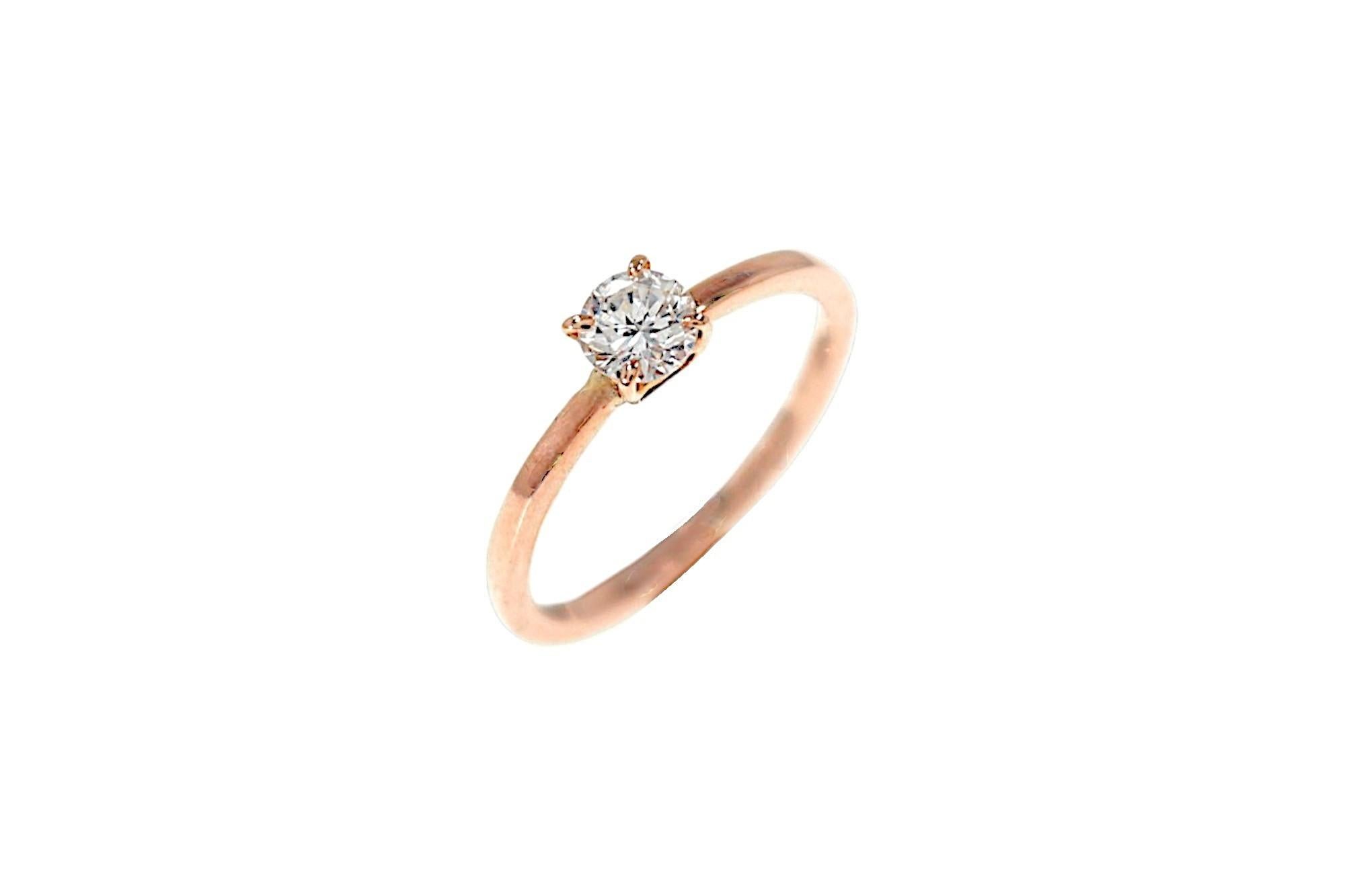 Elegant ring featuring a brilliant cut diamond set in a 9k rose gold prong setting. This ring is also perfect as an engagement gift. The piece was entirely handcrafted in our workshop in Milan. The brilliant cut diamond weighs 0.35 carats. Color H