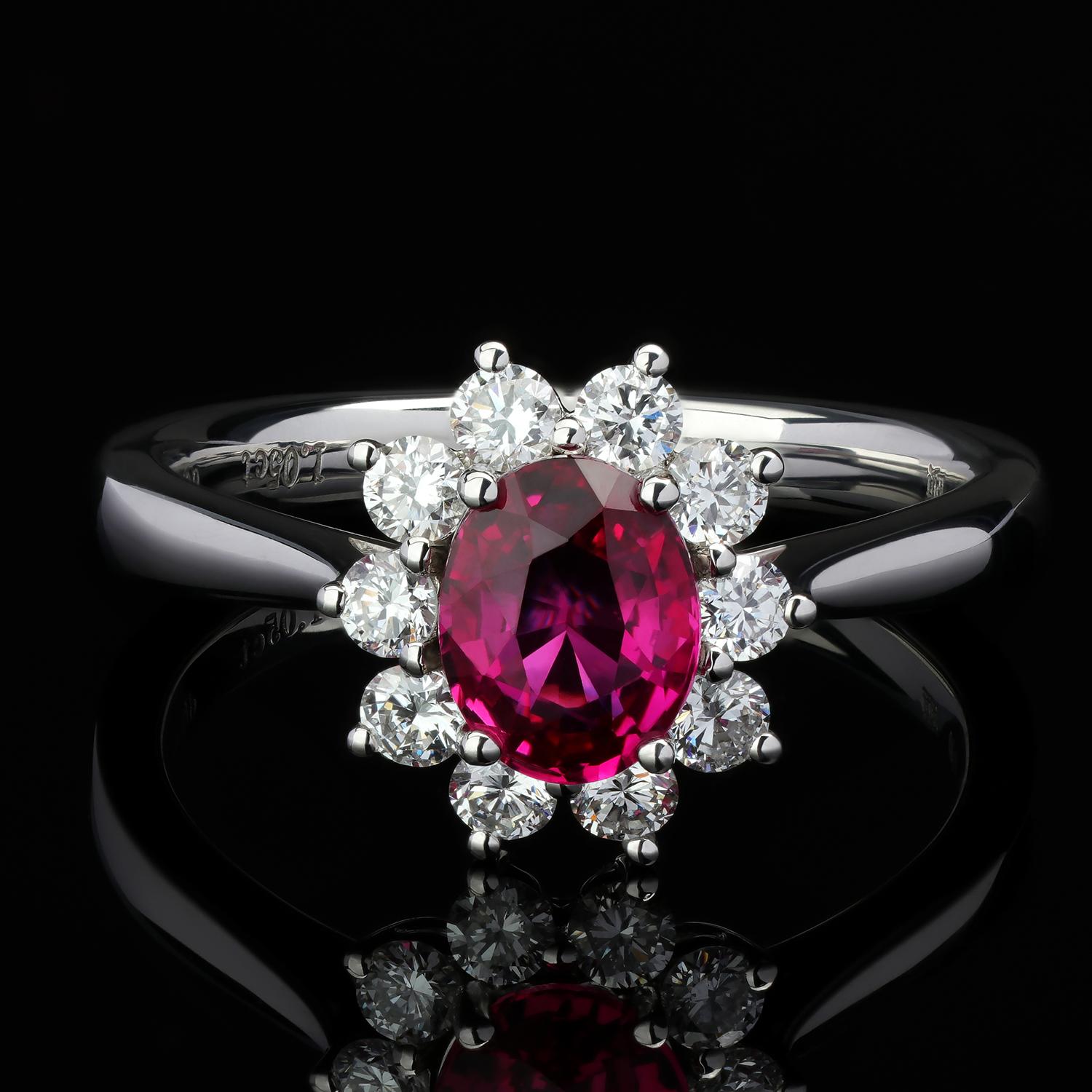An engagement 18K white gold ring with natural Ruby and Diamonds with Jewelry 
ruby origin - Burma
ruby measurements - 0.12 х 0.2 х 0.28 in / 3 х 5 х 7 mm
ruby weight - 1.05 carats
10 diamonds - 0.44 carats
ring weight weight - 4.01 grams
ring size