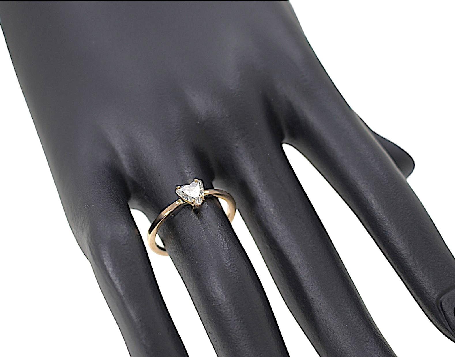 Elegant ring featuring a heart-cut diamond set in a 9k rose gold prong setting. This ring is also perfect as an engagement gift. The piece was entirely handcrafted in our workshop in Milan. The heart-cut diamond weighs 0.37 carats. Color G Clarity