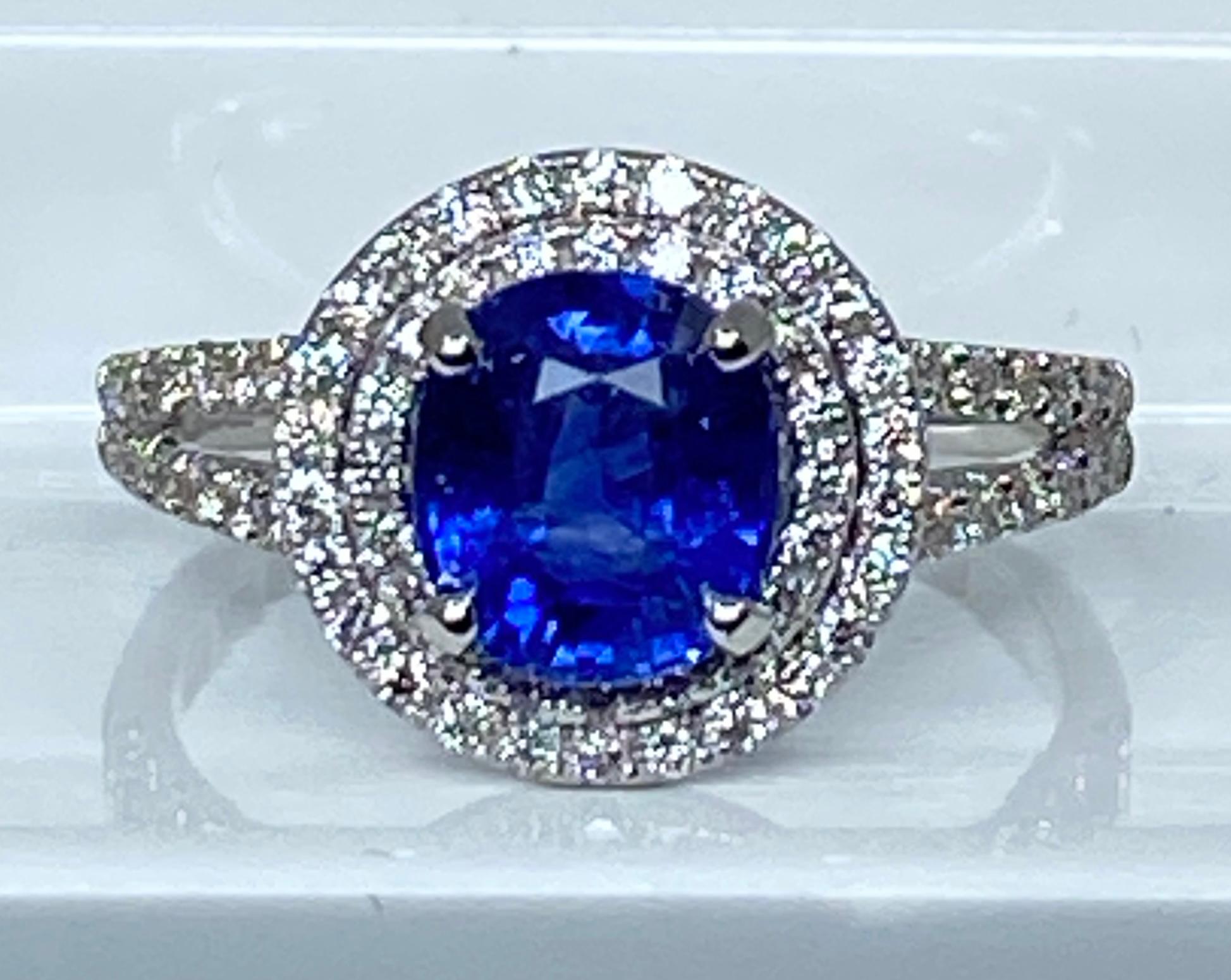 Modern Engagement ring in 18 carat gold set with a sapphire and diamonds  For Sale