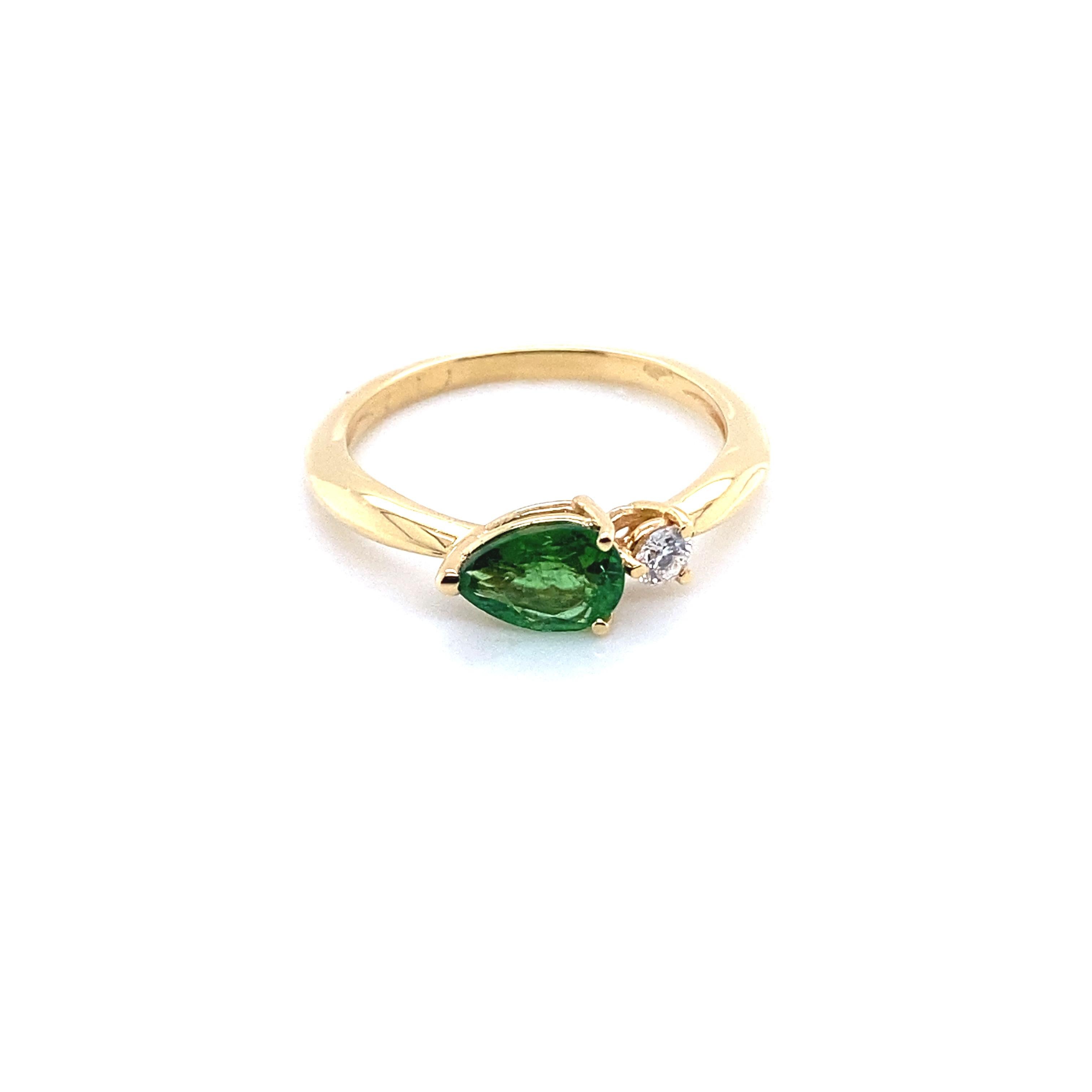 Engagement Ring in Gold with a Green Tourmaline and a Diamond
French Collection by Mesure et Art du Temps.

18 Karats Ring 
The Green Tourmaline is 0.8cm in length and 0.5 cm in width.
The Diamond is 0.09 grams of carats. 
The weight of the gold is