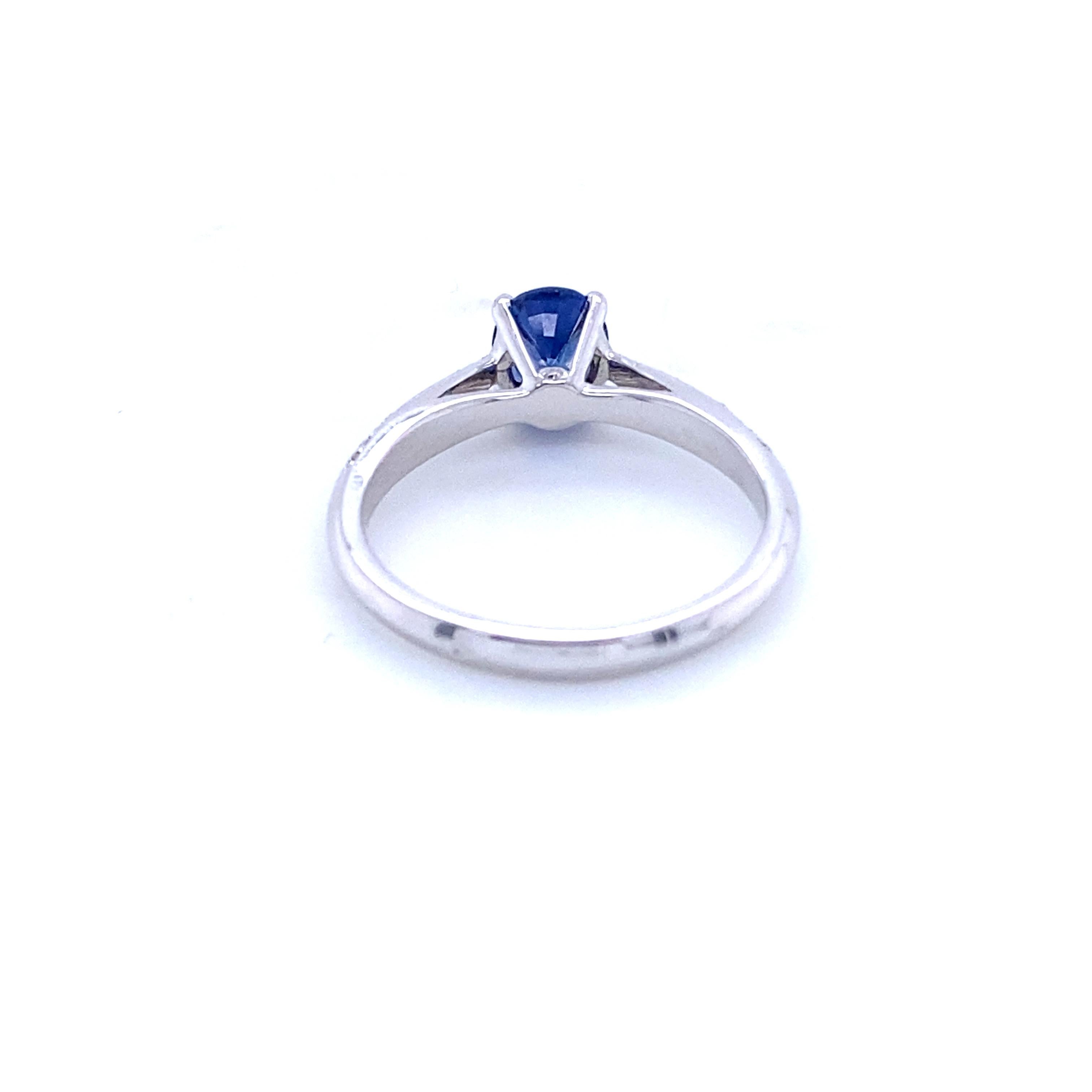 Brilliant Cut Engagement Ring in White Gold with Blue Sapphire and Diamonds For Sale