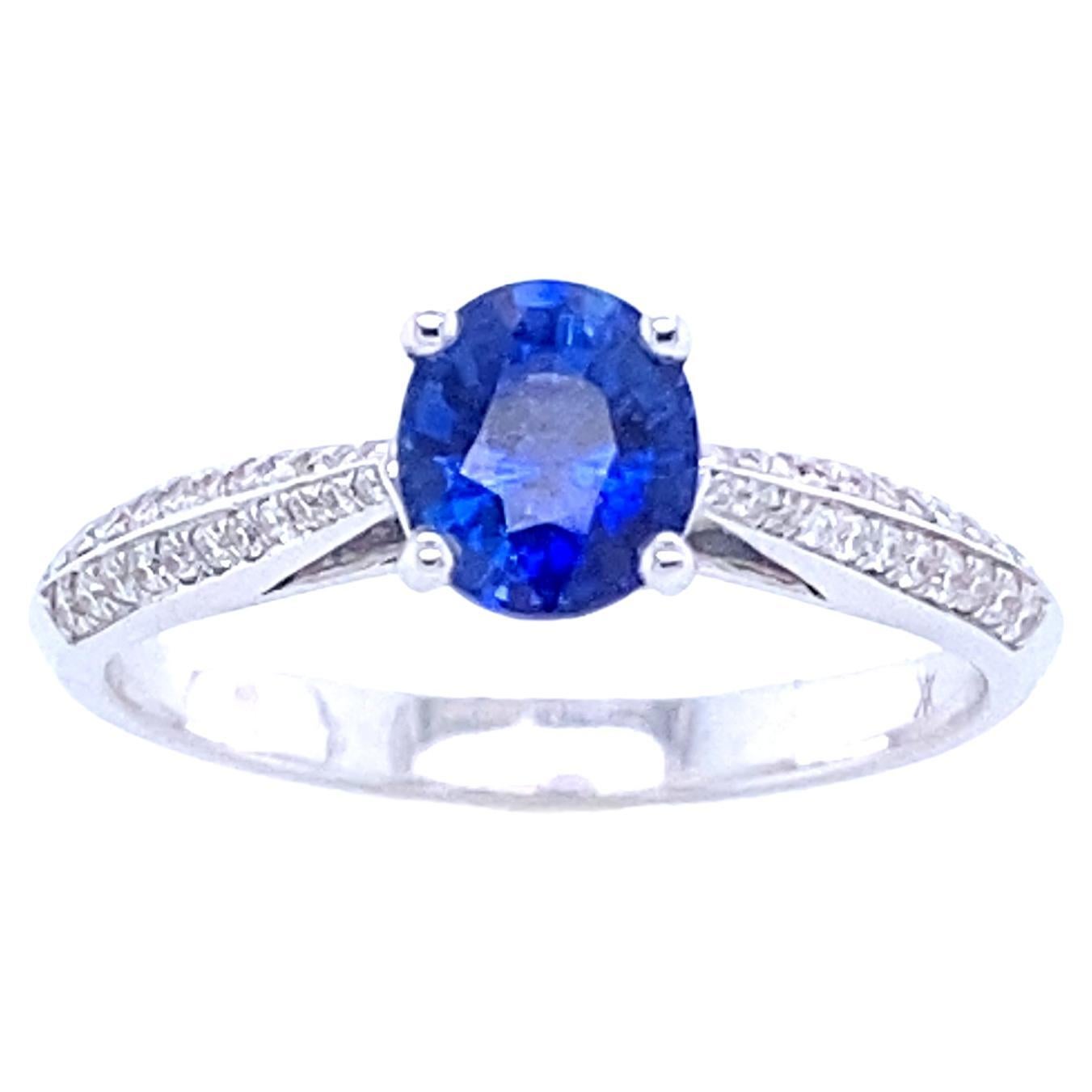 Engagement Ring in White Gold with Blue Sapphire and Diamonds
