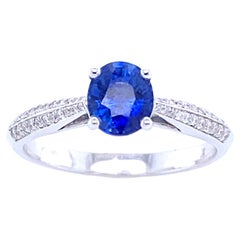 Engagement Ring in White Gold with Blue Sapphire and Diamonds