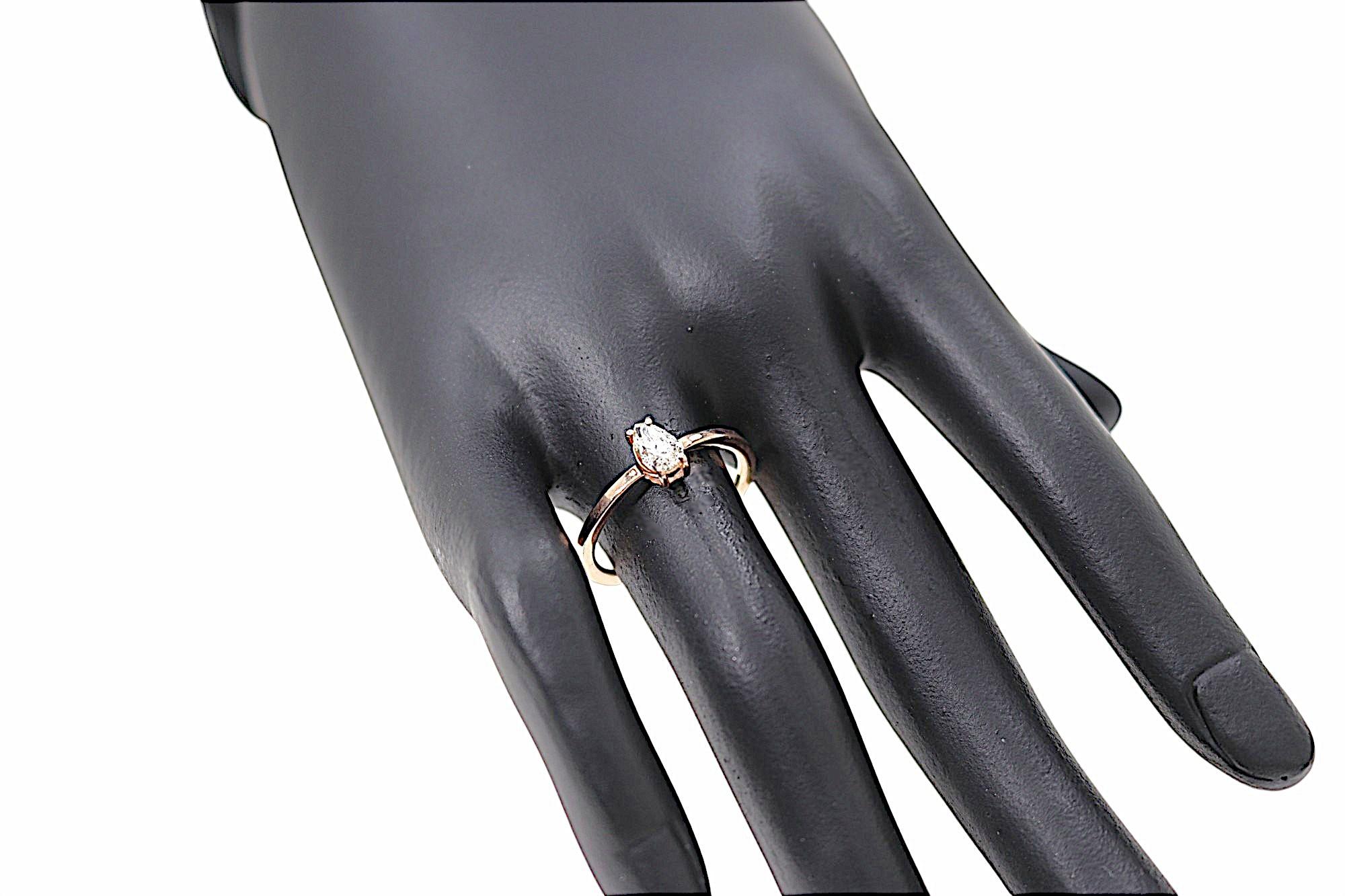 Elegant ring featuring a pear-cut diamond set in a 9k rose gold prong setting. This ring is also perfect as an engagement gift. The piece was entirely handcrafted in our workshop in Milan. The pear-cut diamond weighs 0.43 carats. Color I Clarity