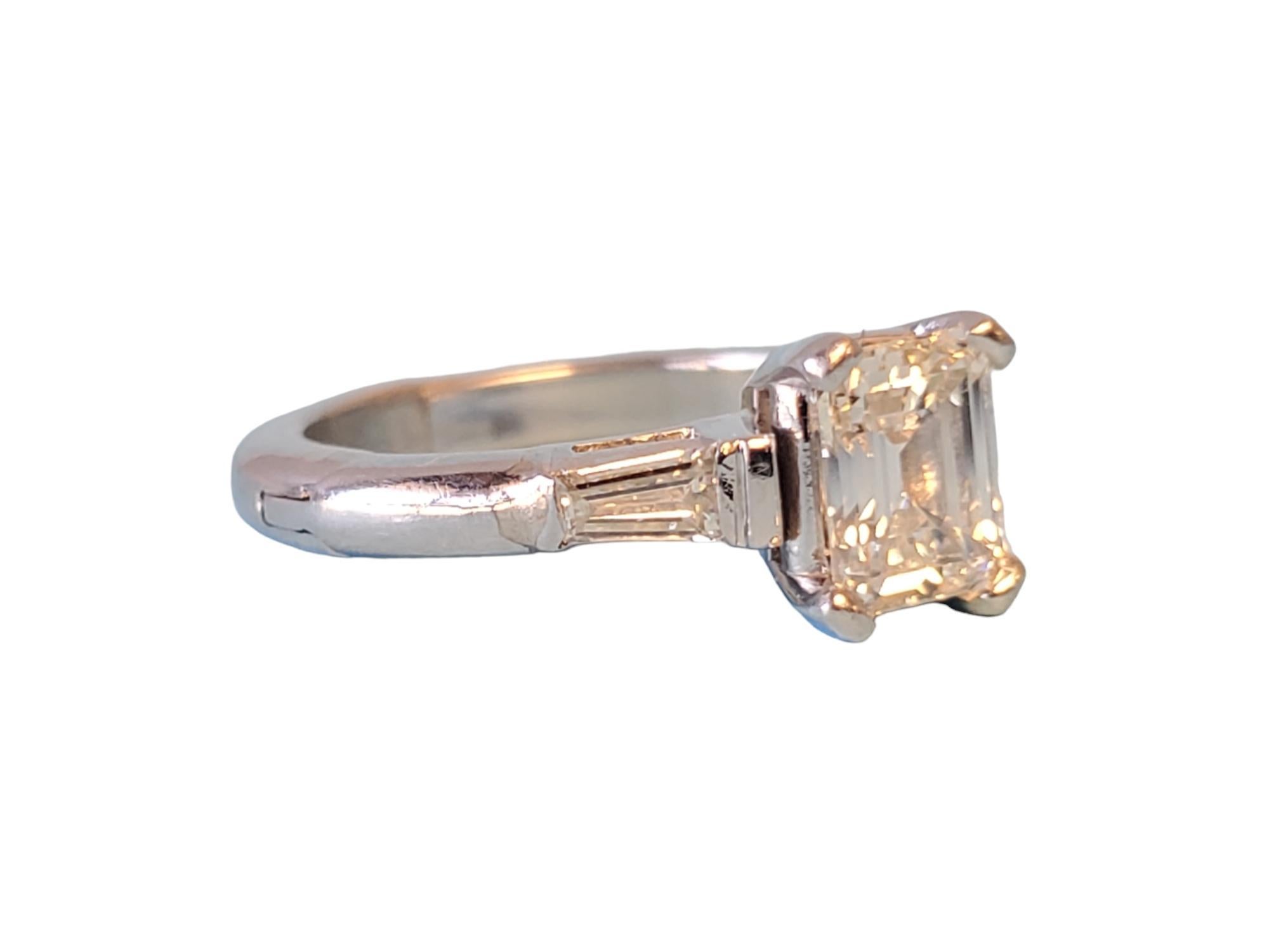 Platinum 1.20tcw Engagement Ring Tapered Baguettes

Listed is a platinum emerald cut engagement ring with tapered baguettes in an adjustable shank. The center stone is a natural diamond 1.00-1.02ct by measurement featuring H-I color and VS2-SI1