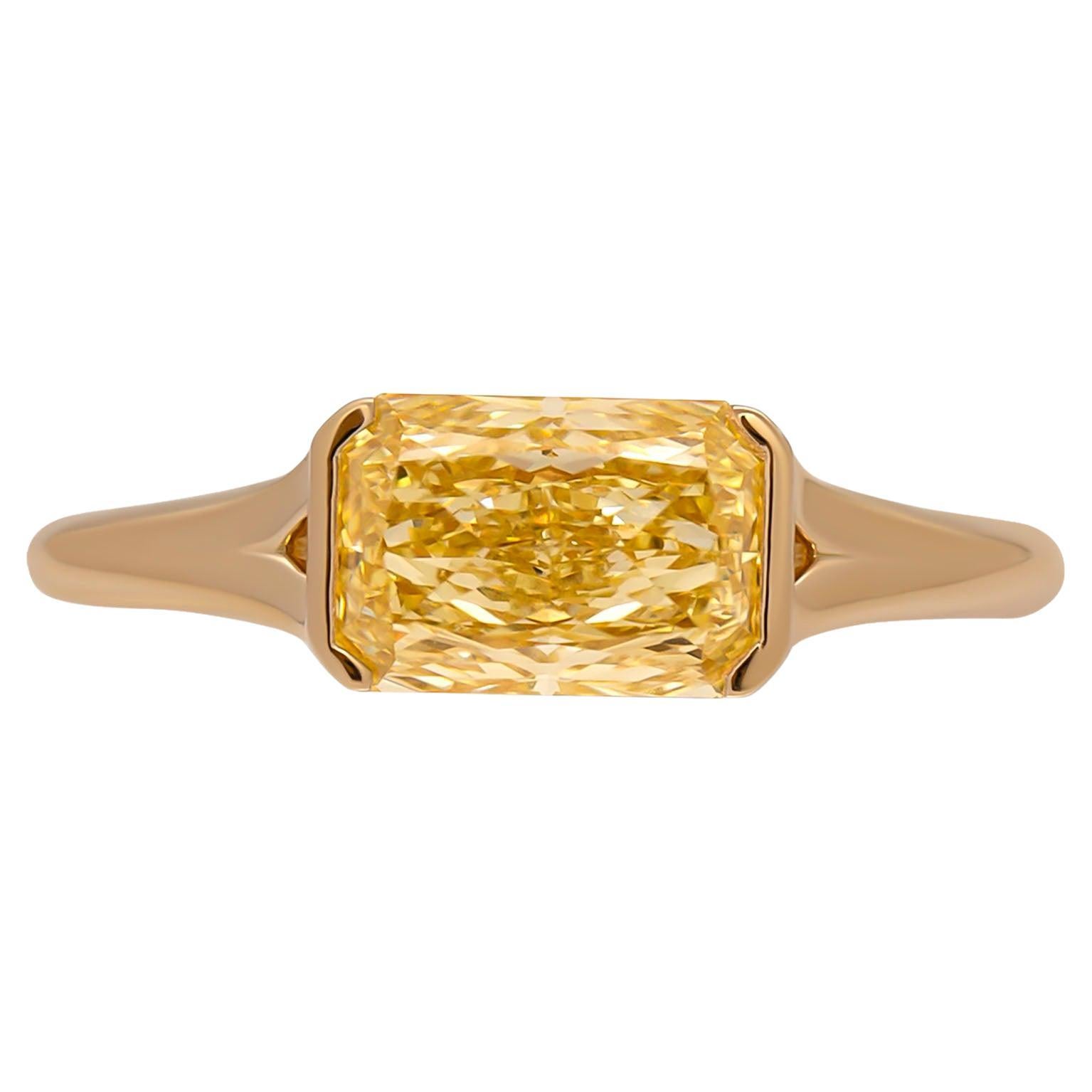  Engagement ring in 18K Yellow 
Center 1.55ct Natural Fancy Yellow Even Flawless Radiant Shape Diamond GIA#6224112864 
Size: 6
East West Design with European shank