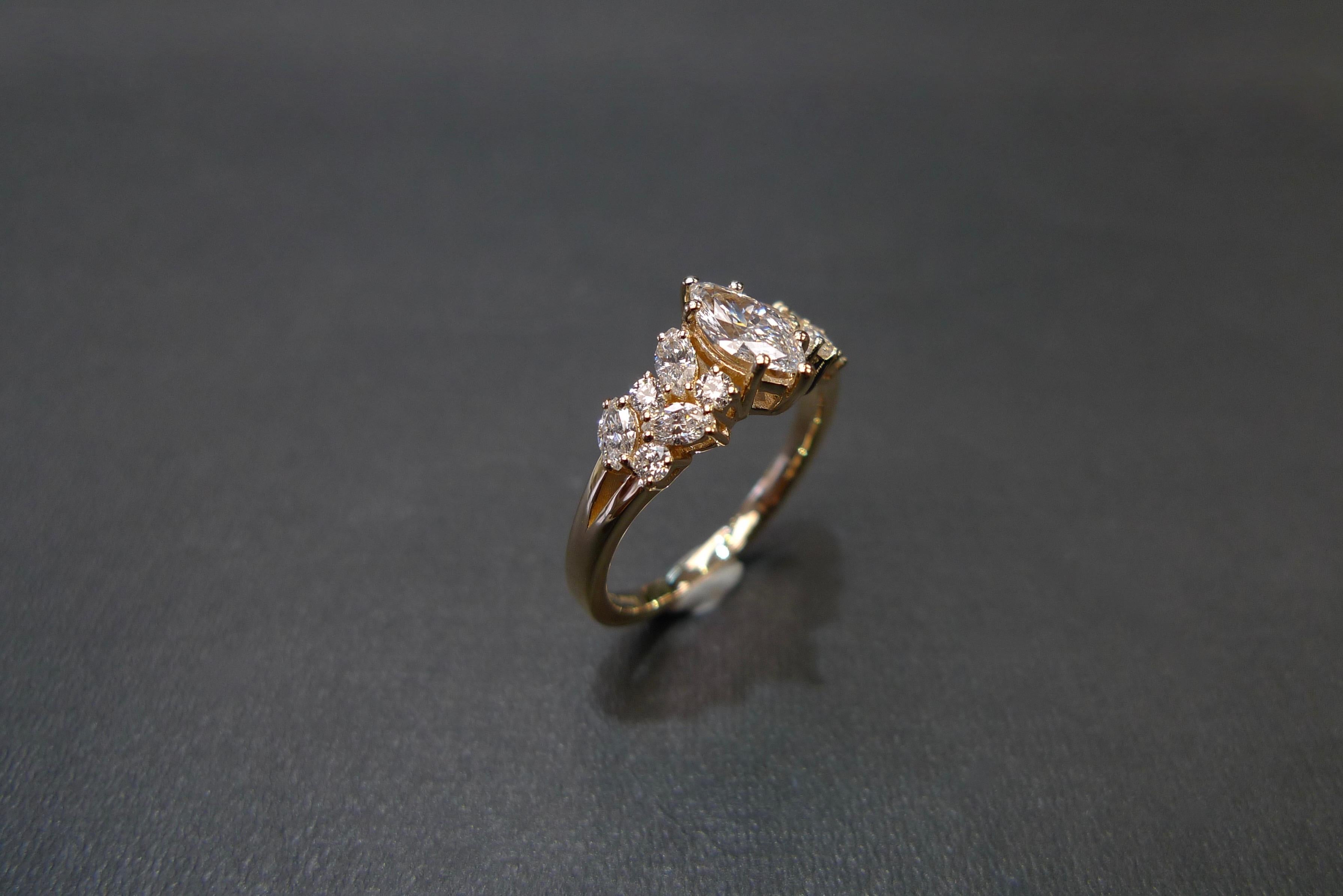 For Sale:  Engagement Ring with Marquise Diamond and Round Brilliant Cut in 18K Rose Gold 9