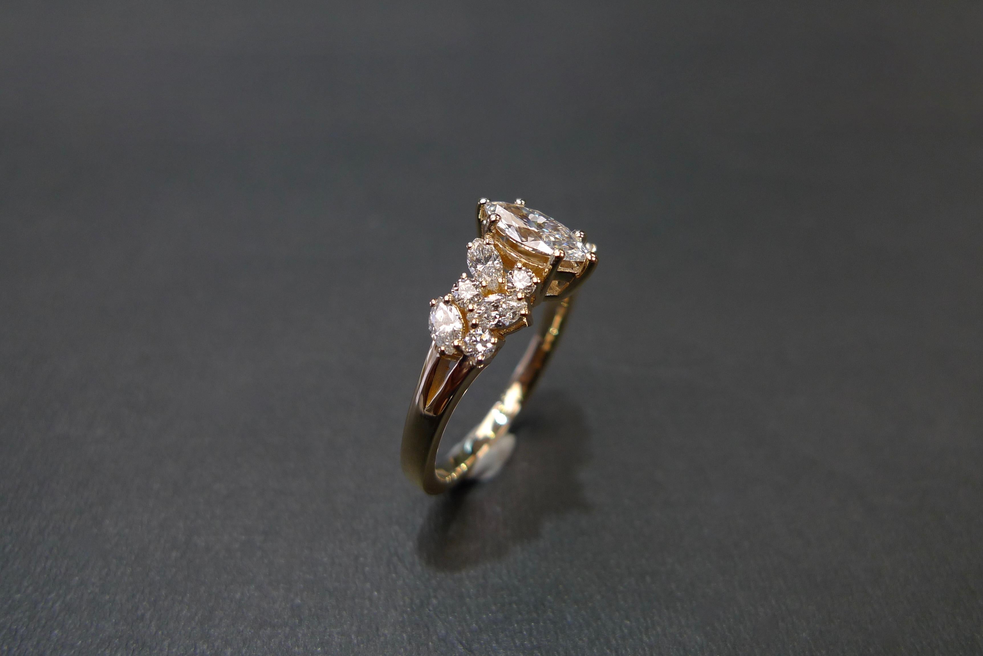 For Sale:  Engagement Ring with Marquise Diamond and Round Brilliant Cut in 18K Rose Gold 12