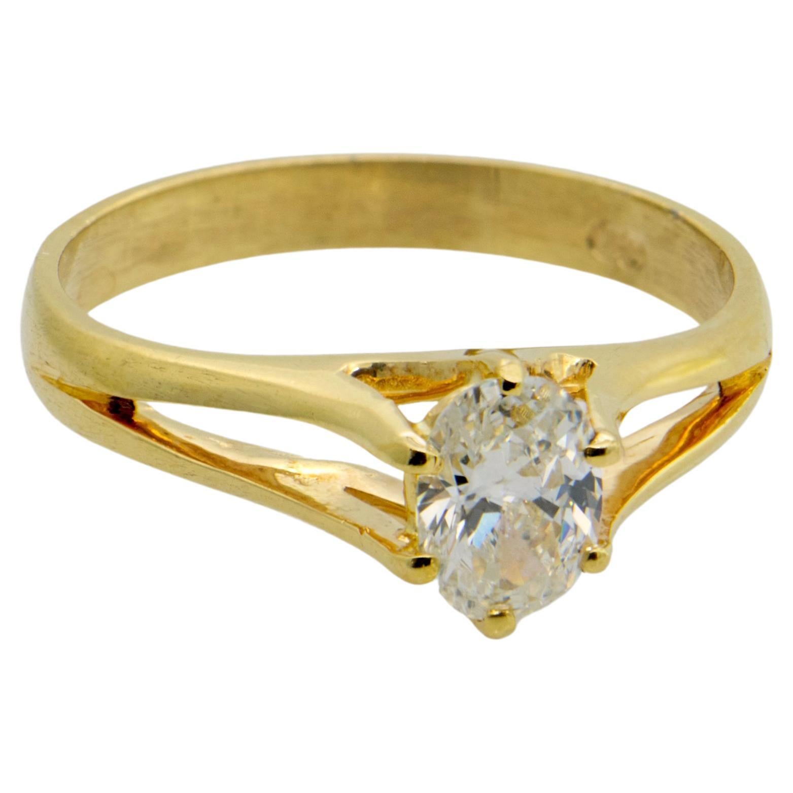 one carat oval diamond ring on hand