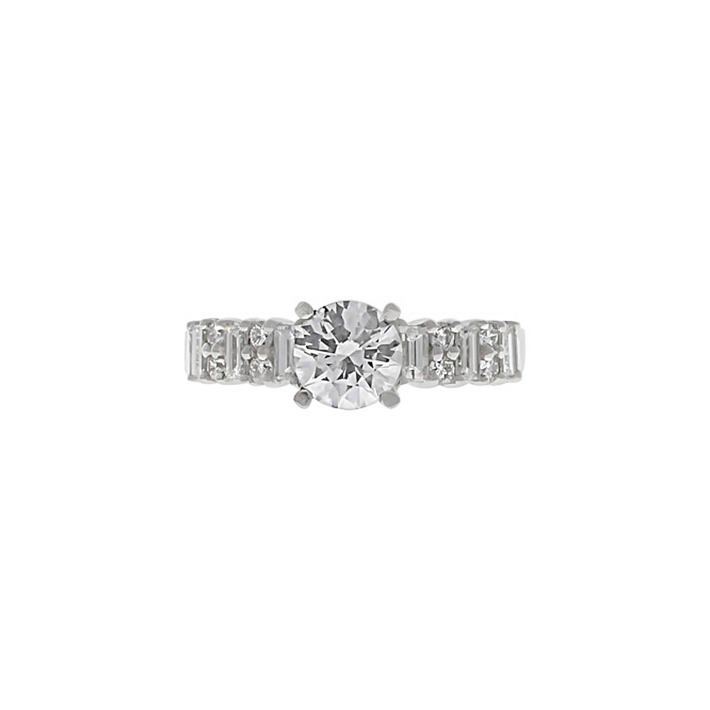 Platinum diamond engagement ring containing one round brilliant cut weighing exactly 1.05 carat, G color, VS2 clarity. The diamond comes with a GIA Grading Report. The mounting contains eight round full cut diamonds and six baguette diamonds.
The