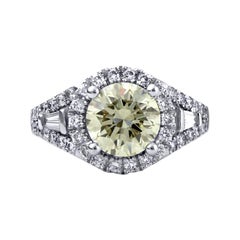 Engagement Ring with Round Cut Center Diamond and Tapered Baguette Side Diamonds