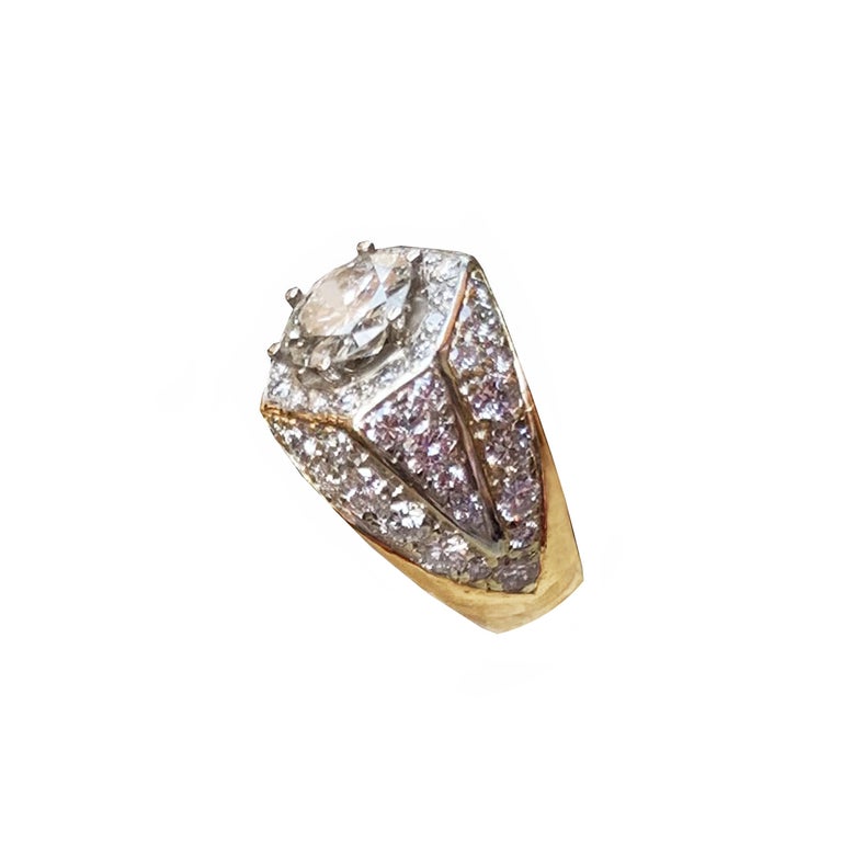 This elegant yellow gold engagement ring is centered with a sparkling round brilliant cut diamond that  weights 1.32 Kt  ; graded I color with VVS2 clarity. The center diamond is accentuated by dazzling round cut diamond accents.The ring weights