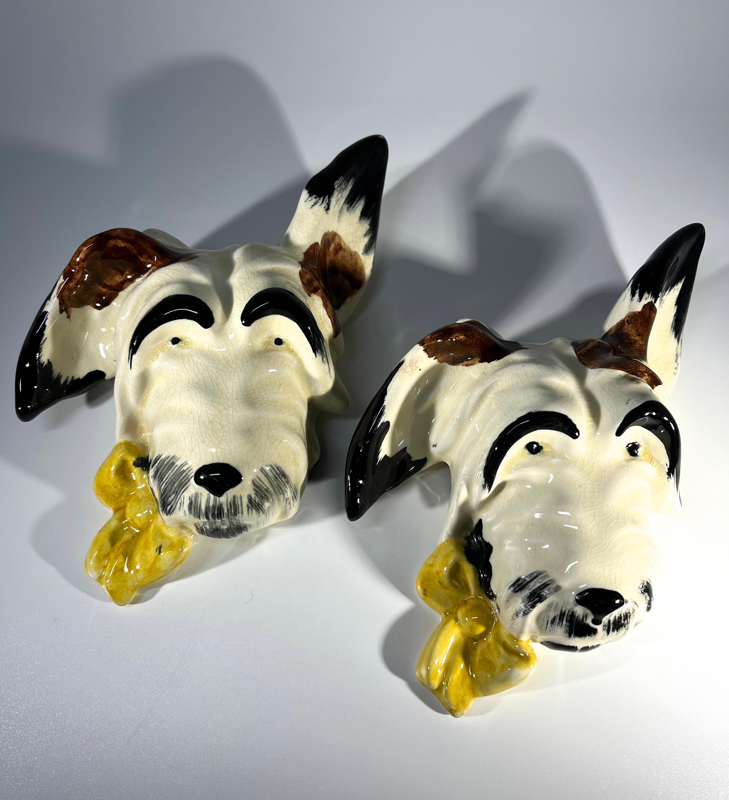 An engaging pair of hand painted English ceramic terriers wall decor
Joyful characters 
Circa 1960's
Height 6.5 inch, Width 5 inch, Depth 2 inch
In good condition. Light crazing adds to their charm
Wear consistent with age and use