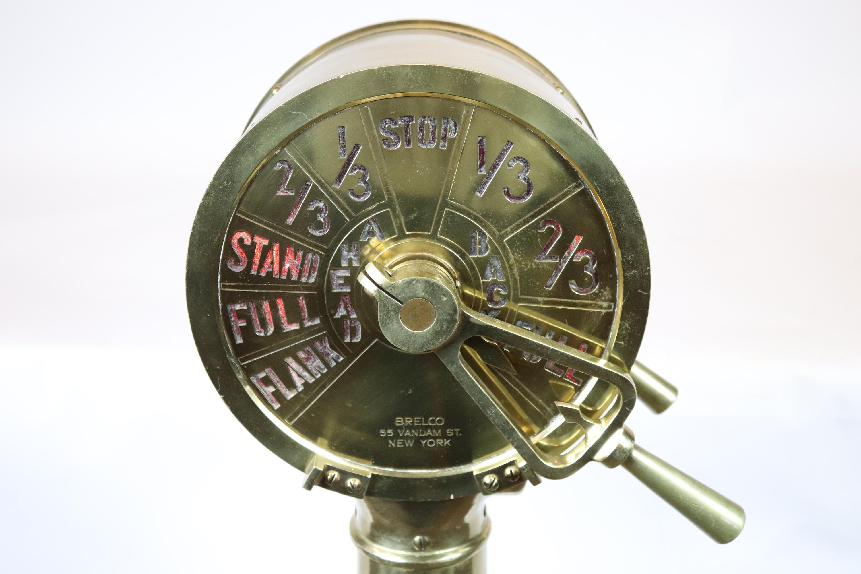 Solid brass ship's engine order telegraph. With brass faceplates with ship's commands back lit though cut out letters. Faceplates have marker's name BRELCO, 55 Vandam St. New York.