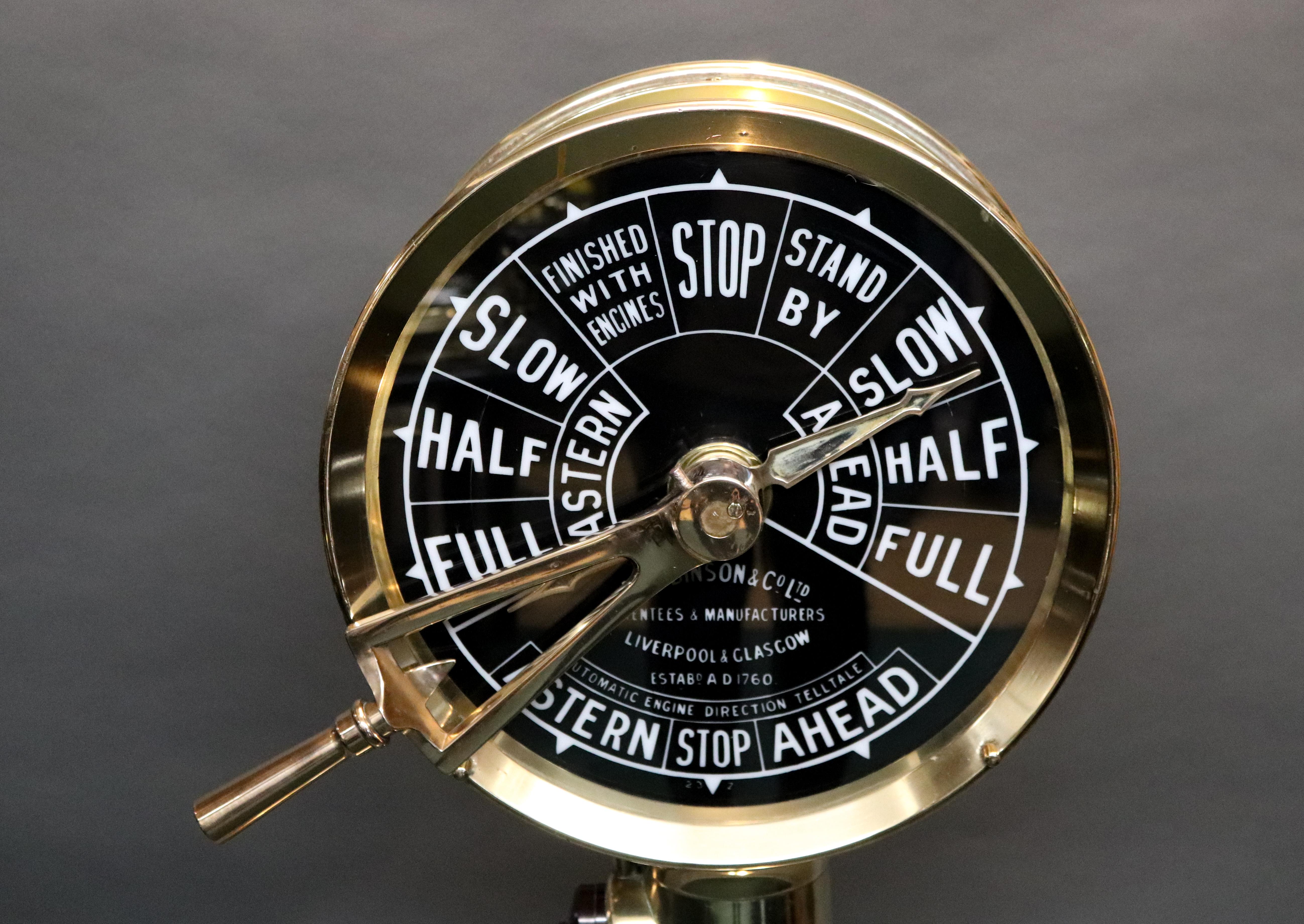 Solid brass engine order telegraph by A. Robinson of Liverpool and Glasgow. Faceplate has full ahead and astern commands. 51