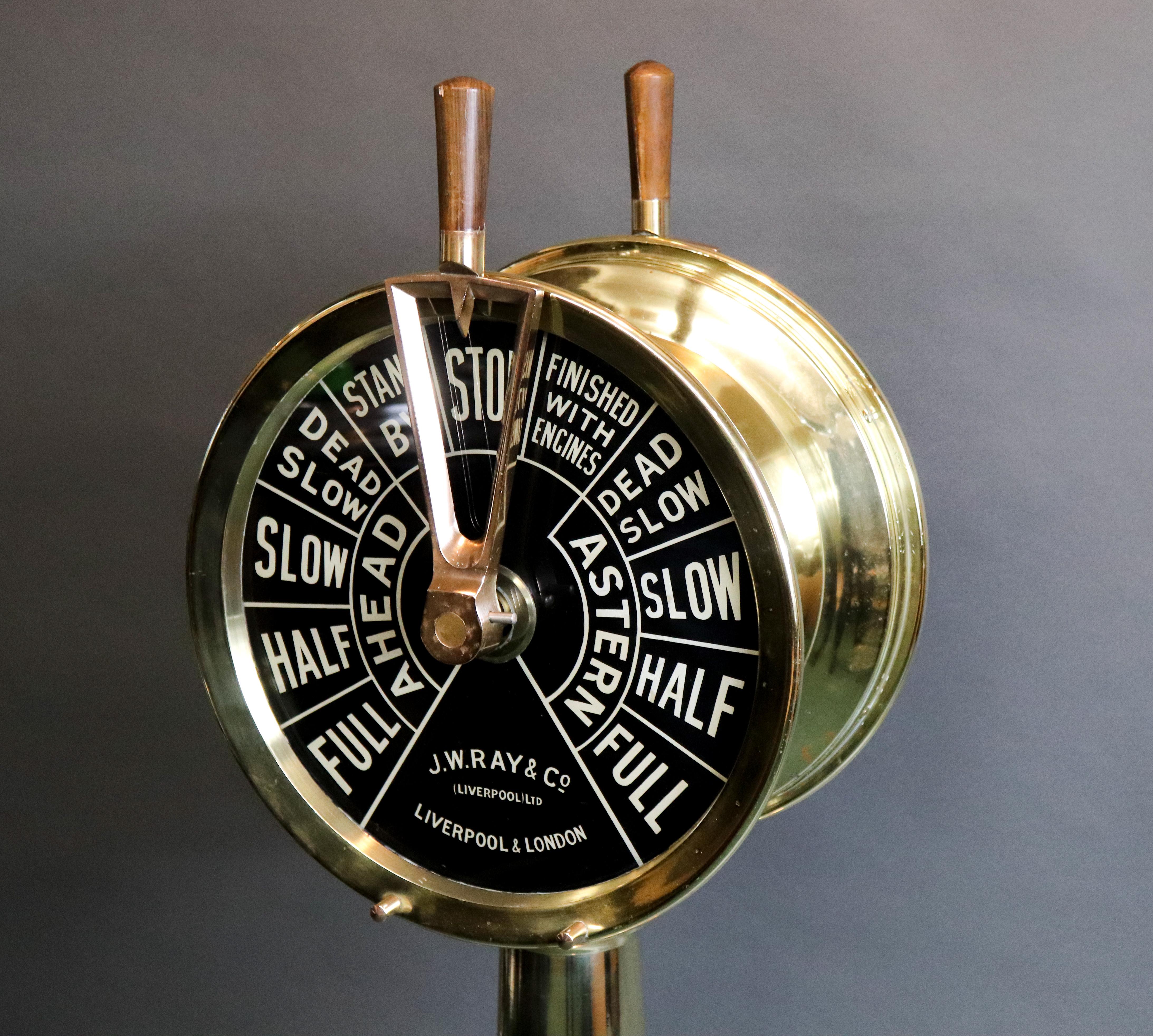 Double faced engine room telegraph by JW Ray & Co. of Liverpool London. Highly polished finish. Faceplates show complete ahead and astern commands. 50