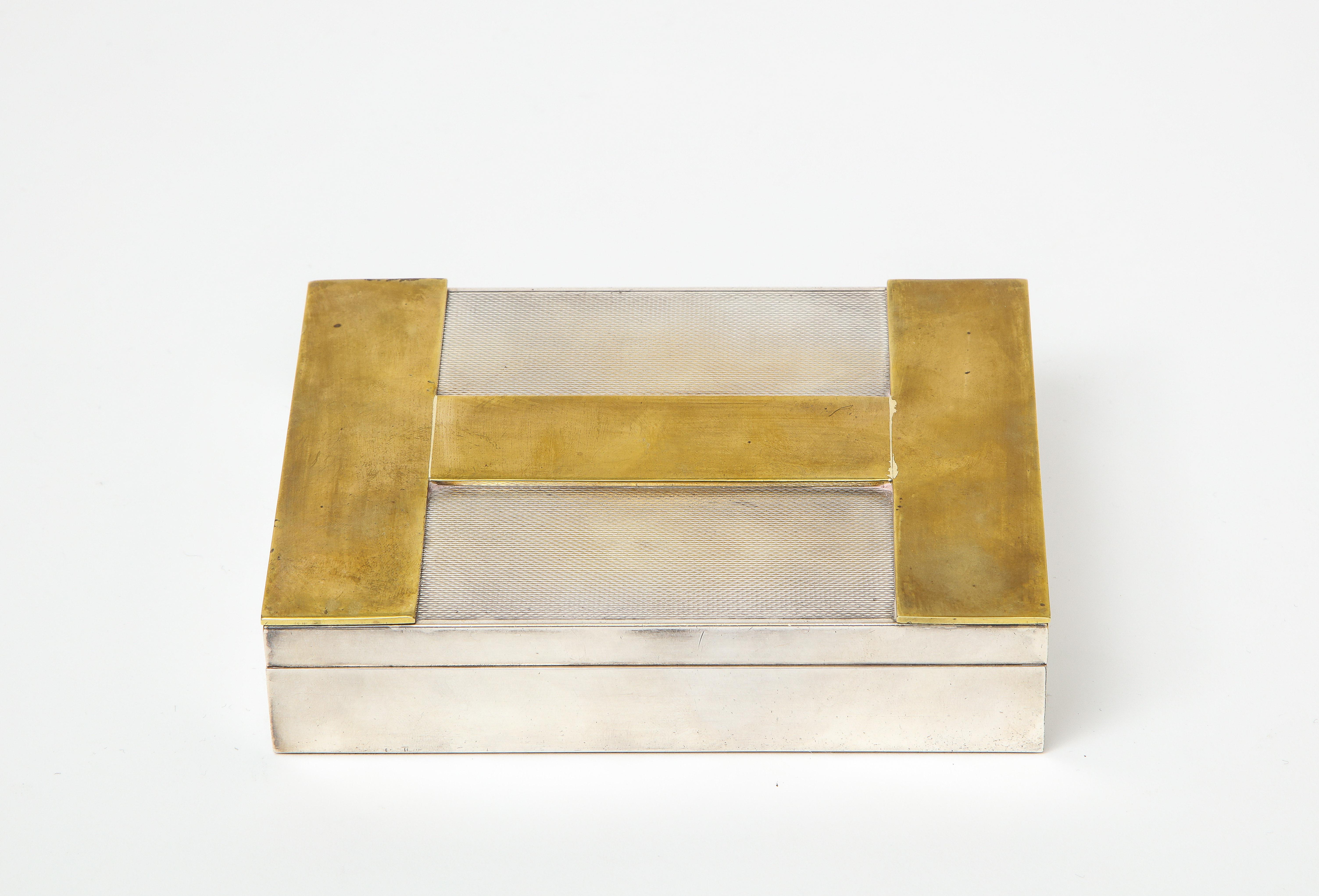 Rare vintage engine turned silver and gold-plated Hermès iconic H-box, France, circa 1960s. 

This elegant hinge-lidded decorative box features a sleek cedar wood interior organized into two compartments.  