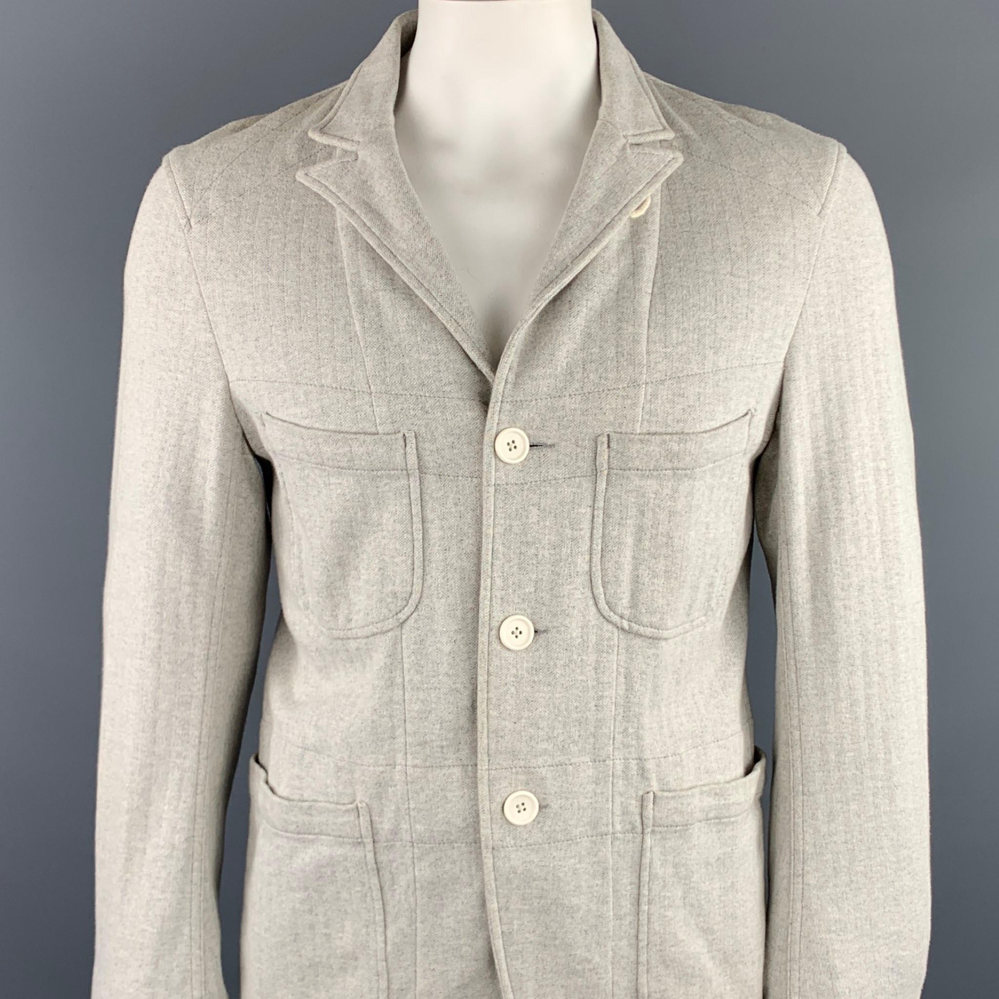 ENGINEERED GARMENTS jacket comes in a light gray heather cotton featuring a peak lapel style, contrast stitching, patch pockets, and a three button closure. As-Is. Made in USA.

Good Pre-Owned Condition.
Marked: US M

Measurements:

Shoulder: 18 in.