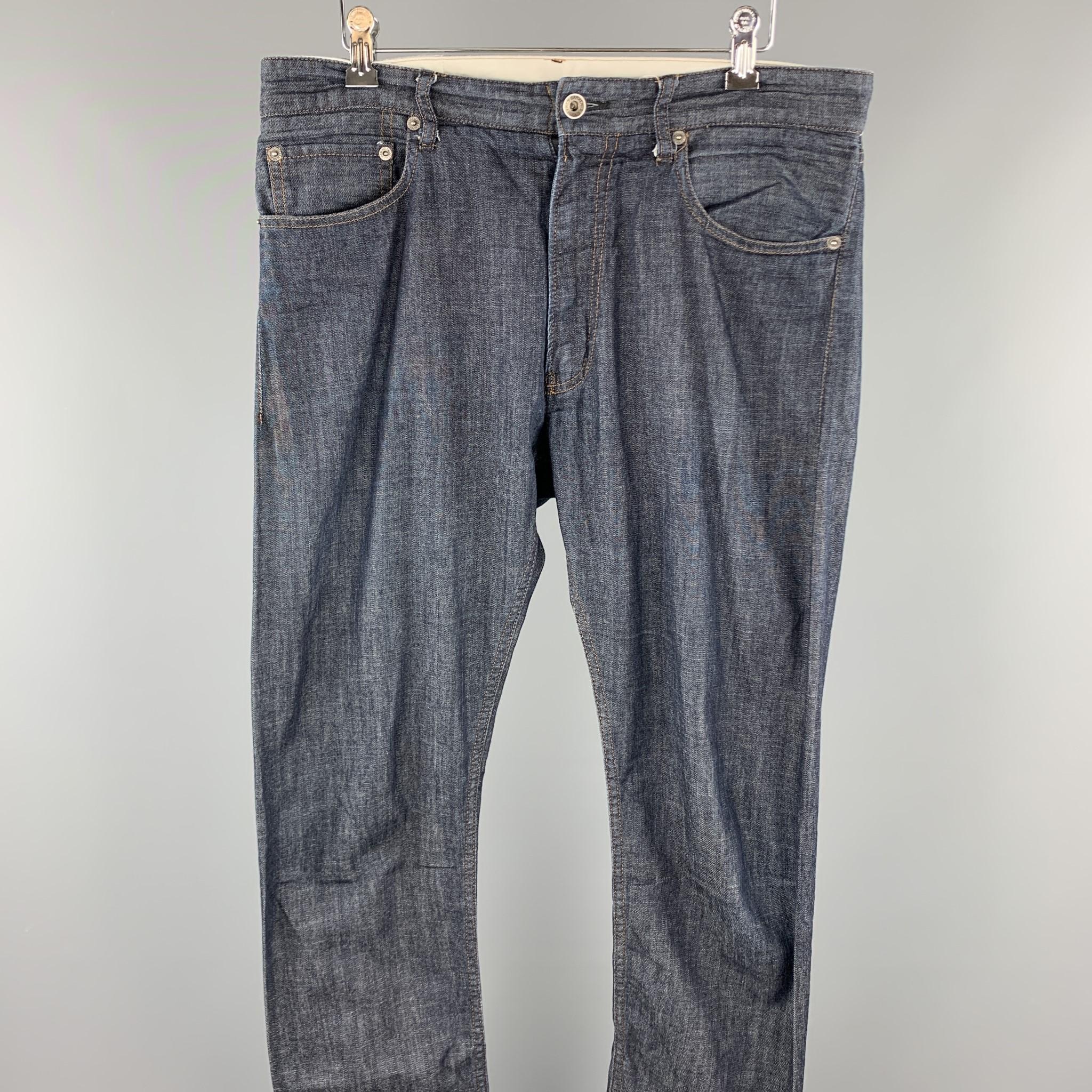 ENGINEERED GARMENTS jeans comes in a indigo cotton featuring contrast stitching and a zip fly closure. Made in USA.

Very Good Pre-Owned Condition.
Marked: US 32

Measurements:

Waist: 34 in.
Rise: 10 in. 
Inseam: 32 in. 