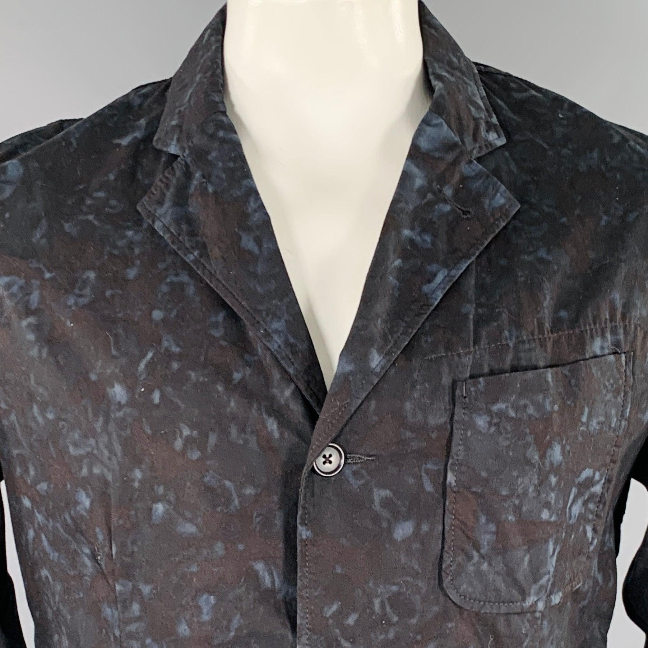 ENGINEERED GARMENTS jacket
in a black and blue cotton woven fabric featuring a marbled print, chore style with three pockets, and three button closure. Made in USA.Excellent Pre-Owned Condition. 

Marked:   L 

Measurements: 
 
Shoulder: 18.5 inches