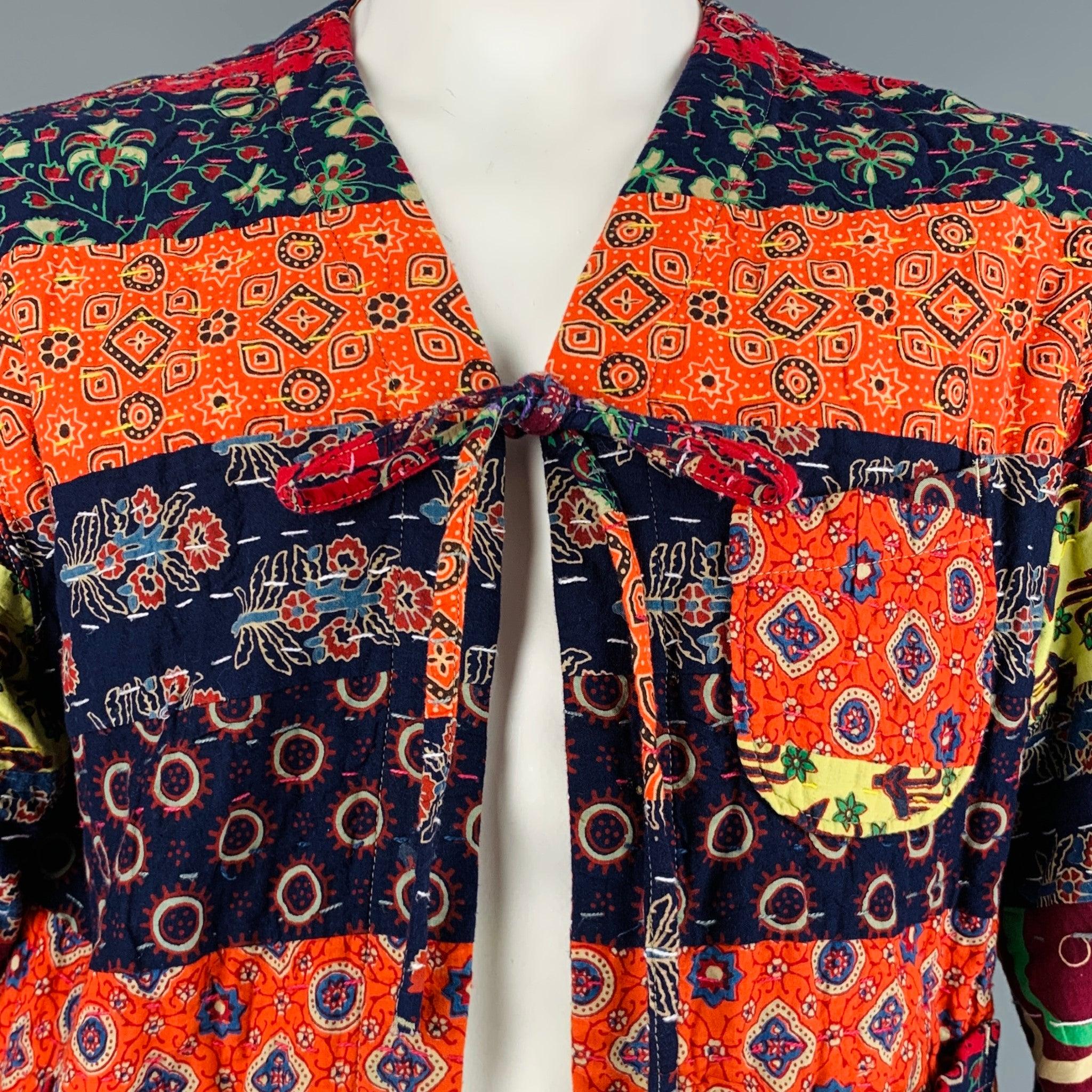 ENGINEERED GARMENTS jacket
in a multi-color cotton fabric featuring mixed patterns with running stitch details, collarless style, and tied front. Made in New York.Excellent Pre-Owned Condition. 

Marked:   3 

Measurements: 
 
Shoulder: 19.5 inches