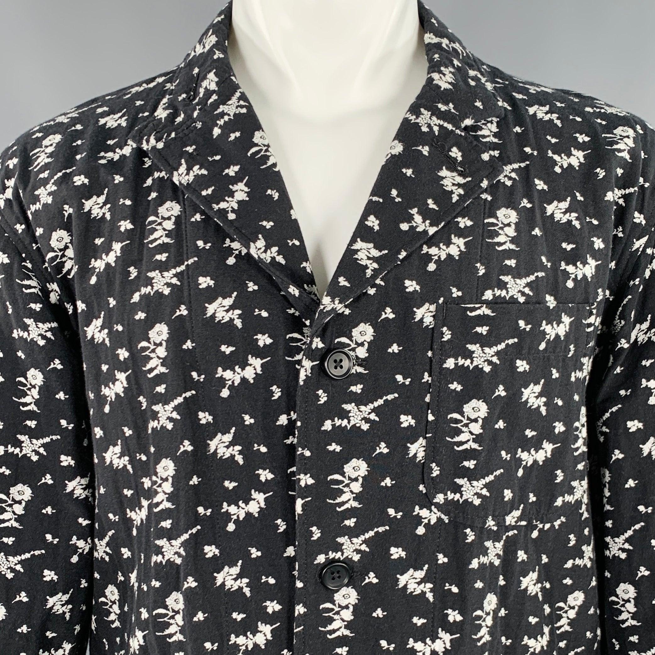 ENGINEERED GARMENTS jacket
in a black and white cotton blend fabric featuring a floral pattern, notch lapel, three pockets, and three button closure. Made in USA.Excellent Pre-Owned Condition. 

Marked:   M 

Measurements: 
 
Shoulder: 22.5 inches