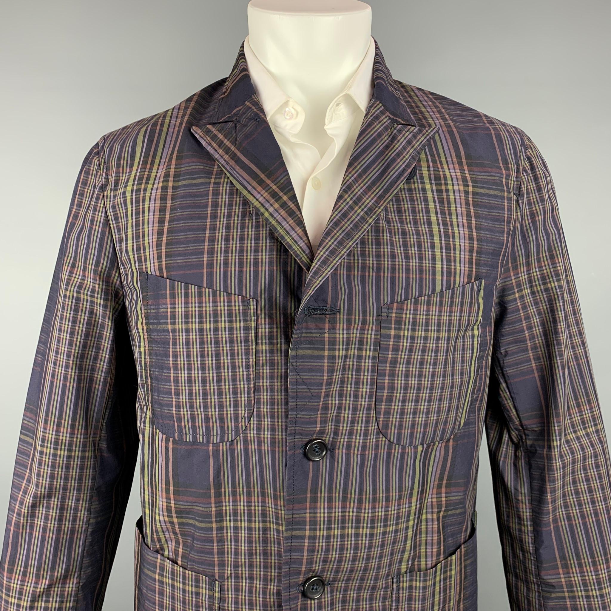 ENGINEERED GARMENTS sport coat comes in a brown & olive plaid cotton with no liner featuring a peak lapel, patch pockets, and a three button closure.

Vey Good Pre-Owned Condition.
Marked: M

Measurements:

Shoulder: 17.5 in.
Chest: 40 in.
Sleeve: