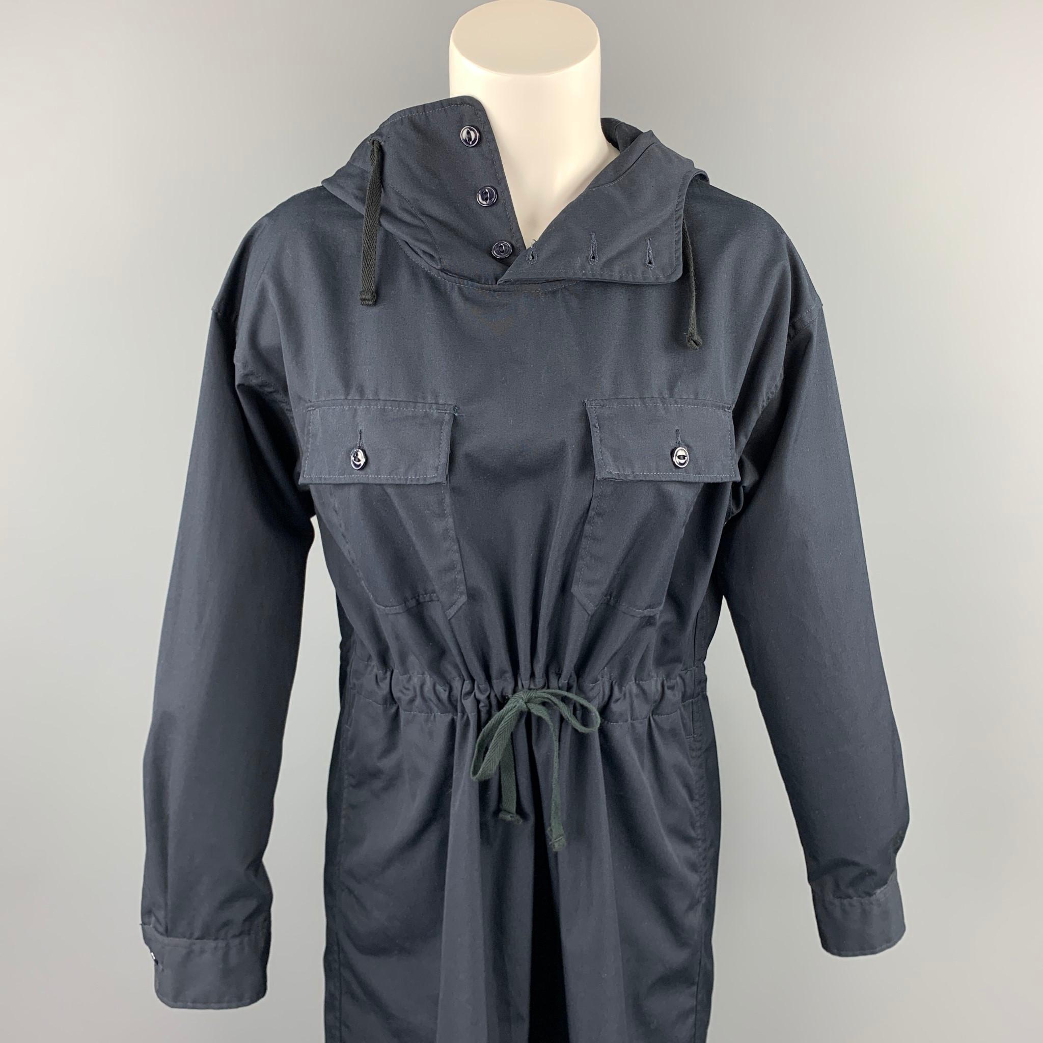 ENGINEERED GARMENTS shirt dress comes in a black polyester / cotton featuring a hooded style, high collar, front pockets, and a drawstring closure. Made in USA.

Very Good Pre-Owned Condition.
Marked: 1

Measurements:

Shoulder: 20 in. 
Bust: 40 in.