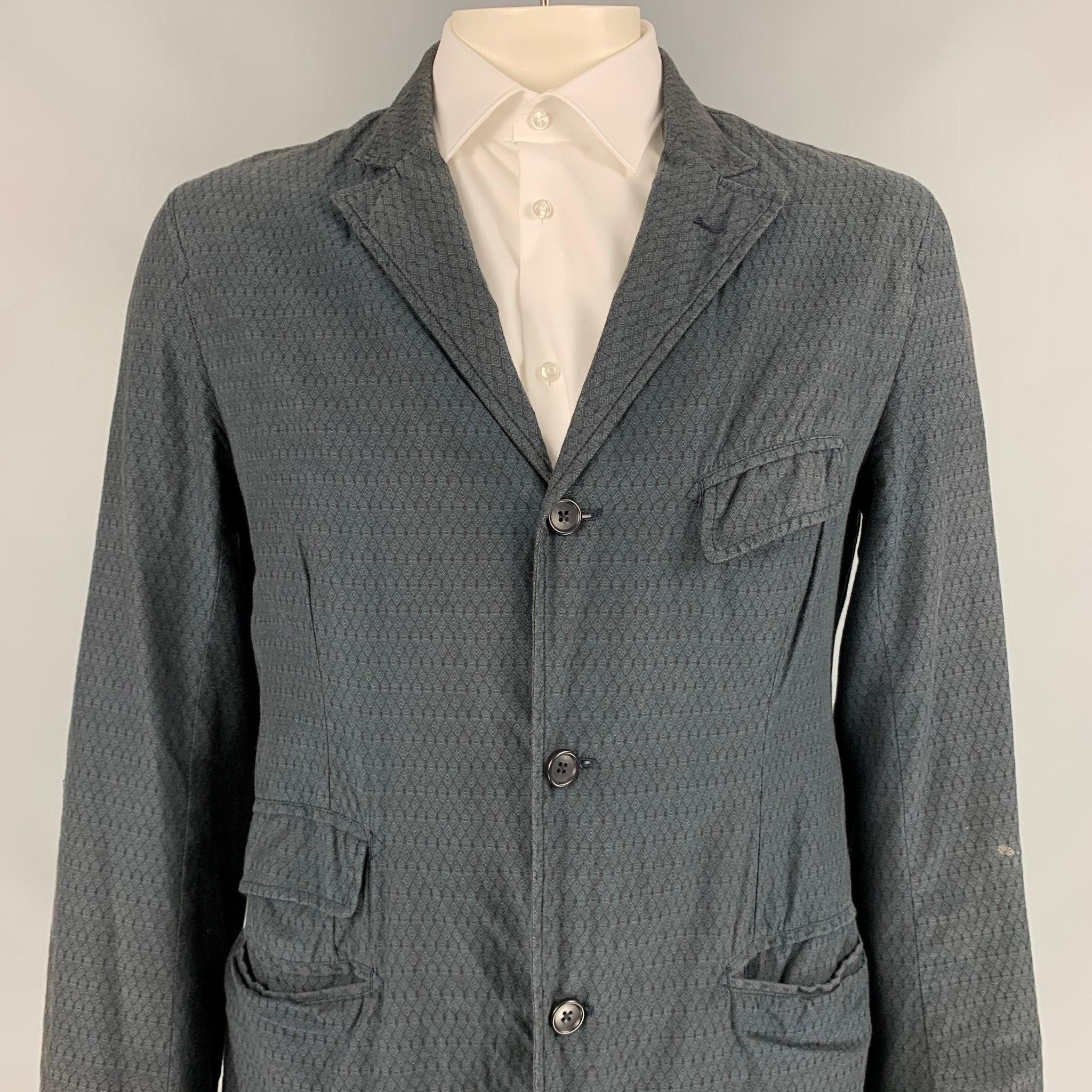 ENGINEERED GARMENTS sport coat comes in a charcoal rhombus cotton with a full liner featuring a notch lapel, front pockets, single back vent, and a three button closure. Made in USA.
Very Good
Pre-Owned Condition. 

Marked:   XL  

Measurements: 

