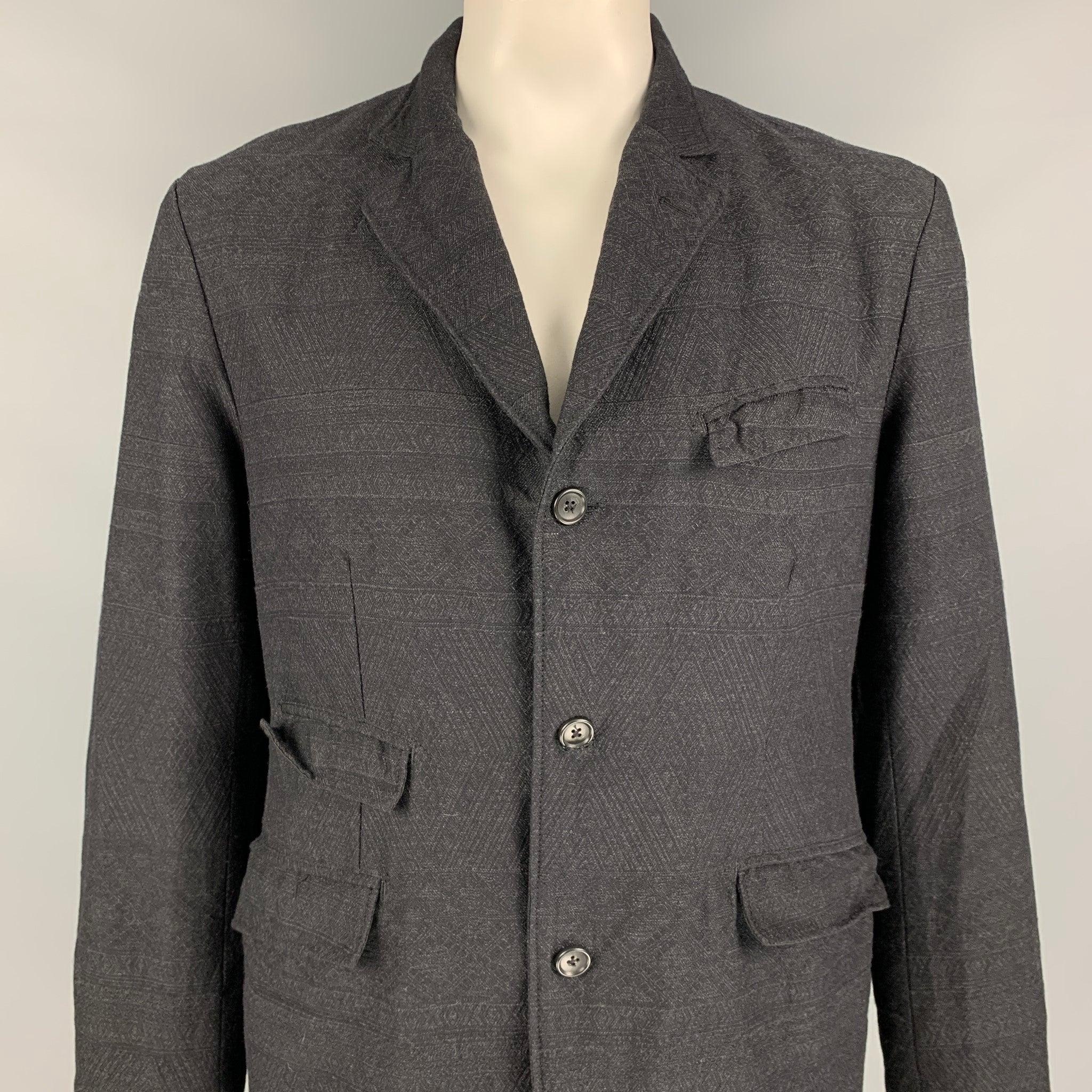 ENGINEERED GARMENTS jacket comes in a charcoal textured cotton / wool with a full liner featuring a notch lapel, flap pockets, and a three button closure. Made in USA.
Very Good
Pre-Owned Condition. 

Marked:   XL 

Measurements: 
 
Shoulder: 19