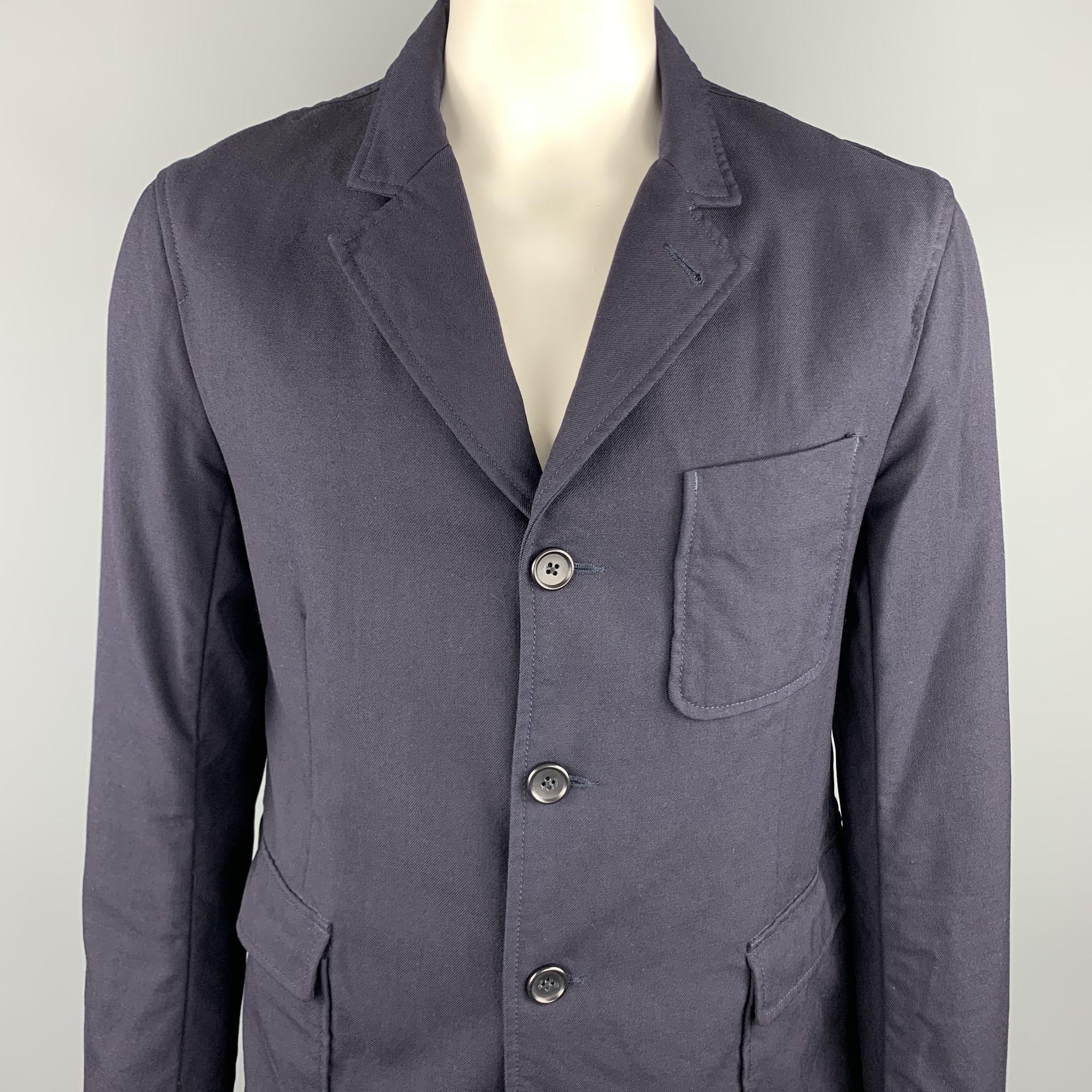 ENGINEERED GARMENTS sport coat comes in a navy wool featuring notch lapel style, patch pockets, and a buttoned closure. Made in USA. 

Excellent Pre-Owned Condition.
Marked: US XL

Measurements:

Shoulder: 18 in. 
Chest: 44 in. 
Sleeve: 27 in.