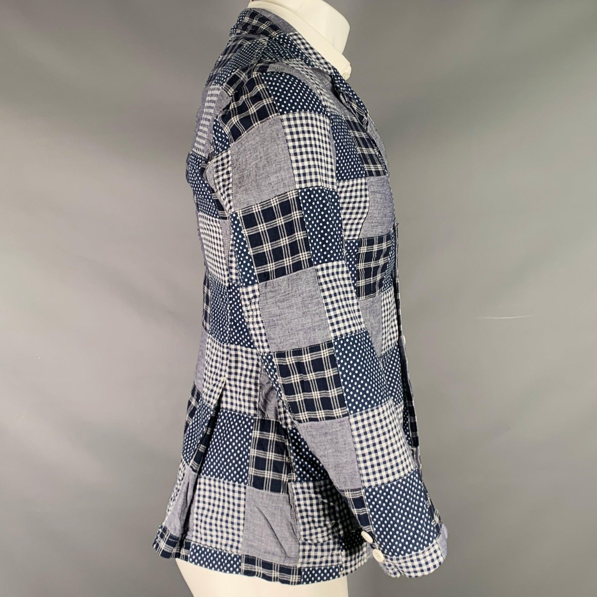 ENGINEERED GARMENTS sport coat
in a navy and white cotton fabric featuring patchwork design, notch lapel, faux double vented back, and three button closure. Made in USA.Excellent Pre-Owned Condition. 

Marked:   XS 

Measurements: 
 
Shoulder: 17.5