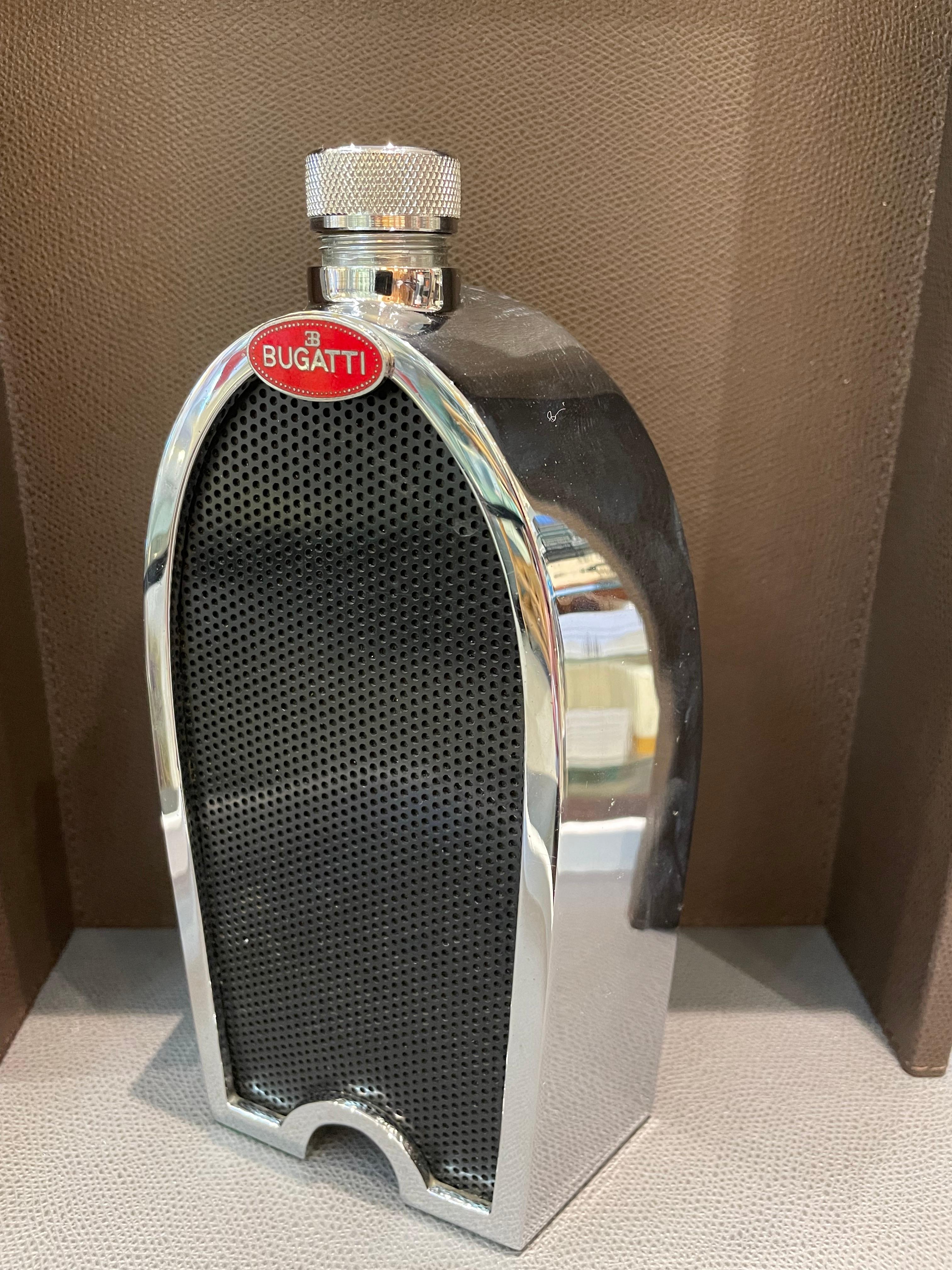 Iconic and identifiable car radiators and grills have evolved into objects of beauty. This rare and vintage Ruddspeed decanter is a unique collectible piece in pristine condition. This Bugatti decanter is fully functional lined with glass. Heavily