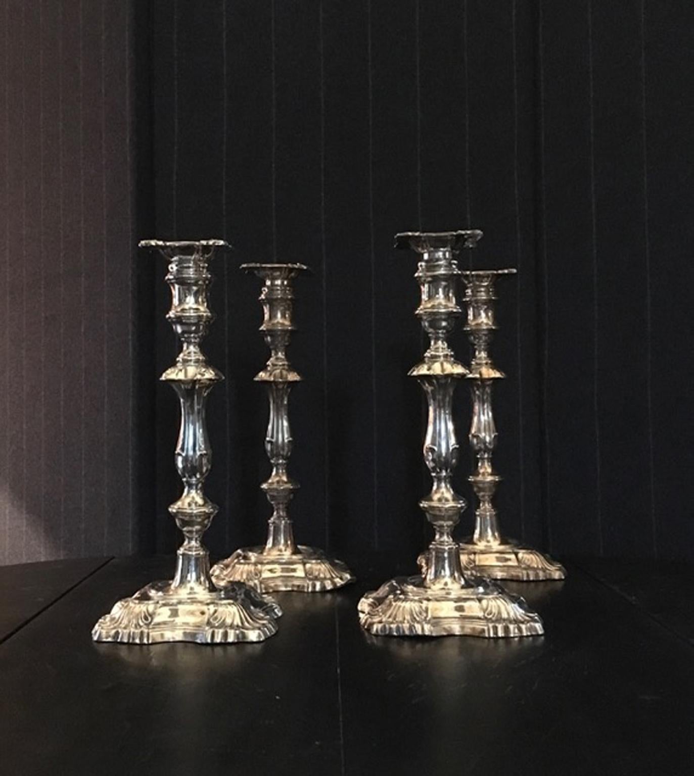 England early 20th century set four silver Victorian candleholders.

This pleasant set was made in England as a marriage gift. On one of these pieces there is the dedication to the newlyweds
A unusual four pieces of candleholders to decorate a large
