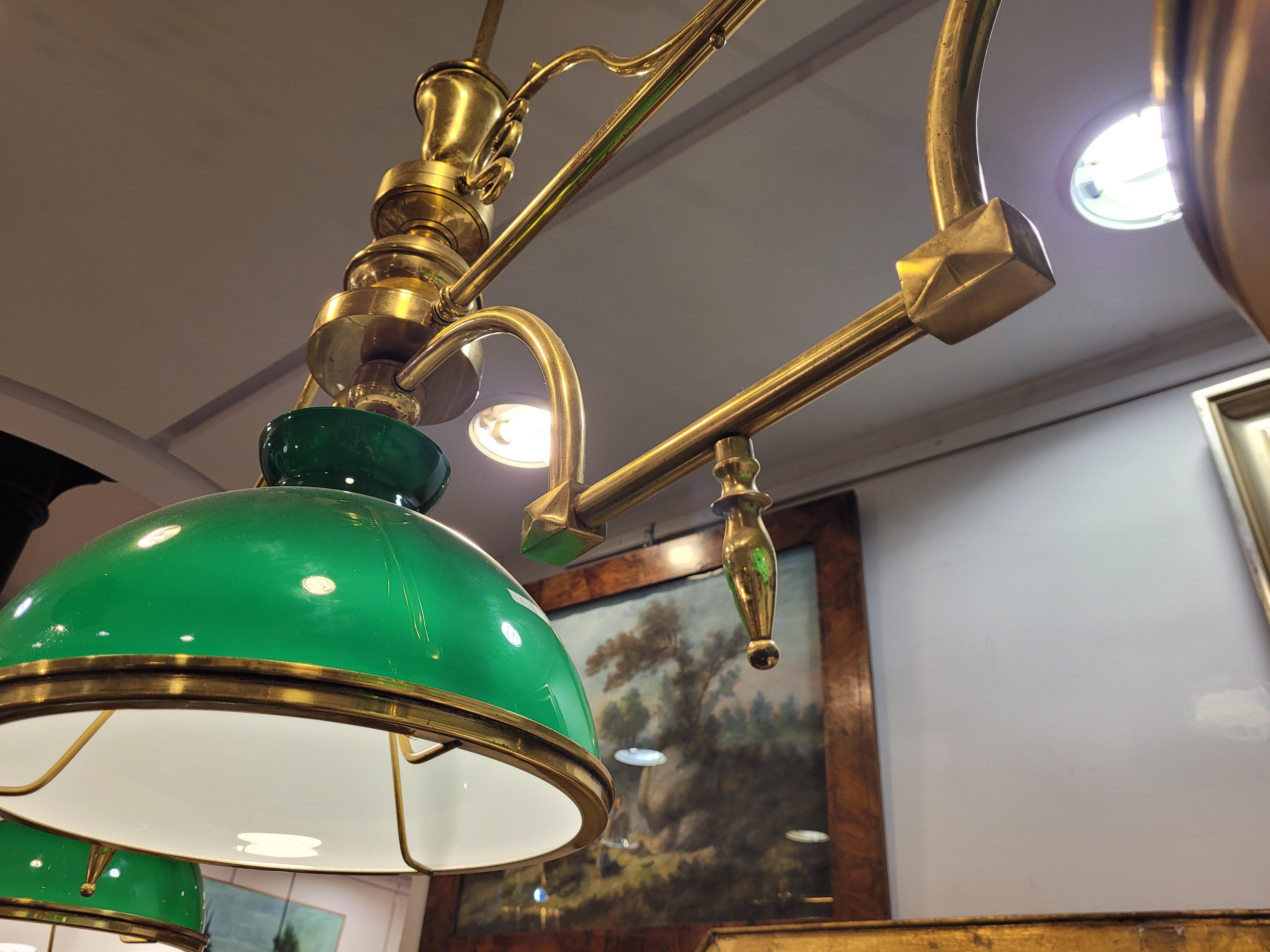 Amazing and unique  billiard lamp or pool table lamp made at the beginning of the 20th century in France. Large in size, it is configured on a large horizontal axis from which three green tulips hang. All of this attached to the ceiling by a large