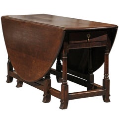 Antique English 1780s Georgian Drop-Leaf Gateleg Table with Oval Top and Turned Base