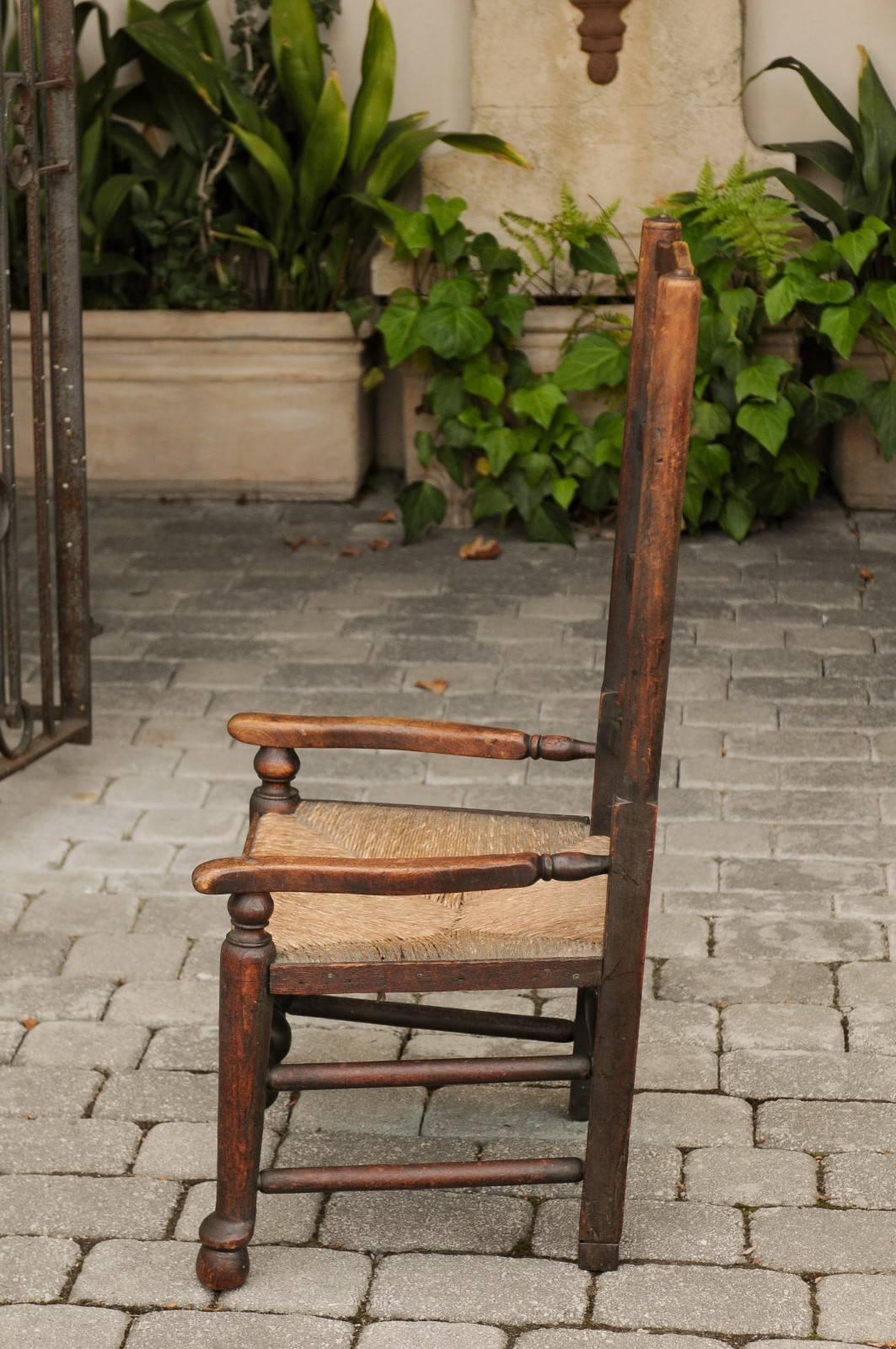 Turned English 1780s Oak William and Mary Style Open Arm Youth Chair with Rush Seat For Sale