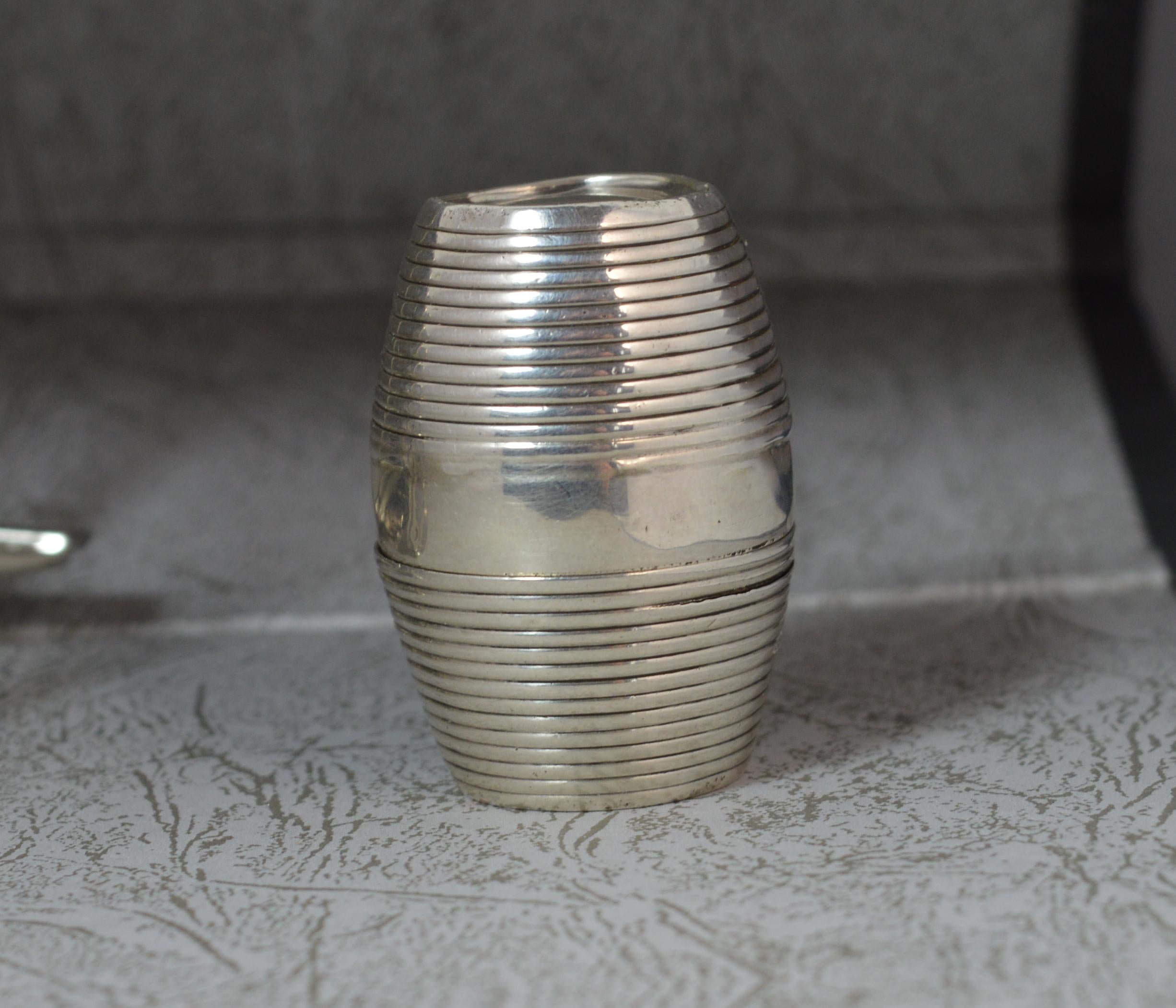 A highly desirable and rare Georgian solid silver nutmeg grater.
Fine barrel shape.

Hallmarks ; lion, King George head, date letter O, London assay, makers initials SM
Weight ; 24.8 grams
Size ; 21mm diameter base , 44mm tall
Condition ; Okay for