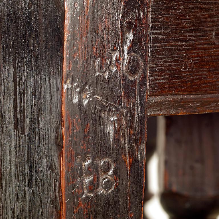 A late 17th century oak Gateleg table of small proportions; excellent color and in original untouched condition; the owner’s initials ‘TB’ are carved at the top of one of the legs.

English, circa 1680-1690.