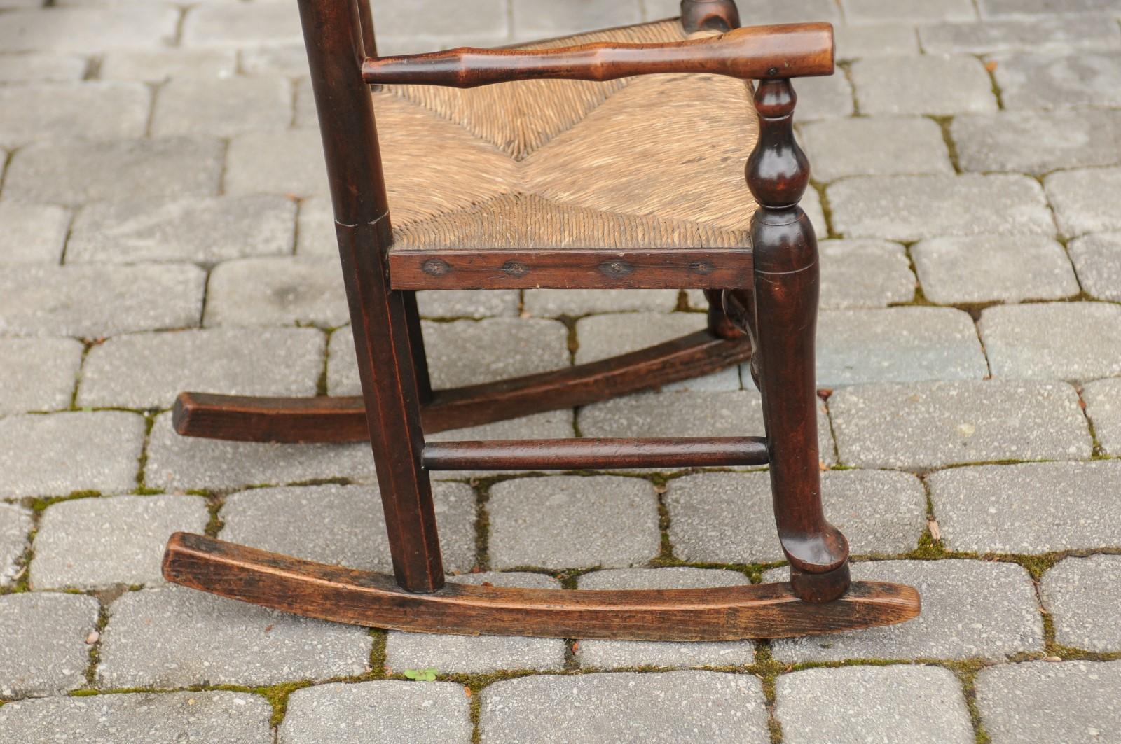 English 1800s Georgian Period Plum Wood Child's Rocking Chair with Rush Seat For Sale 3