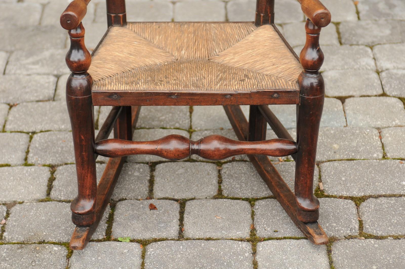 19th Century English 1800s Georgian Period Plum Wood Child's Rocking Chair with Rush Seat For Sale