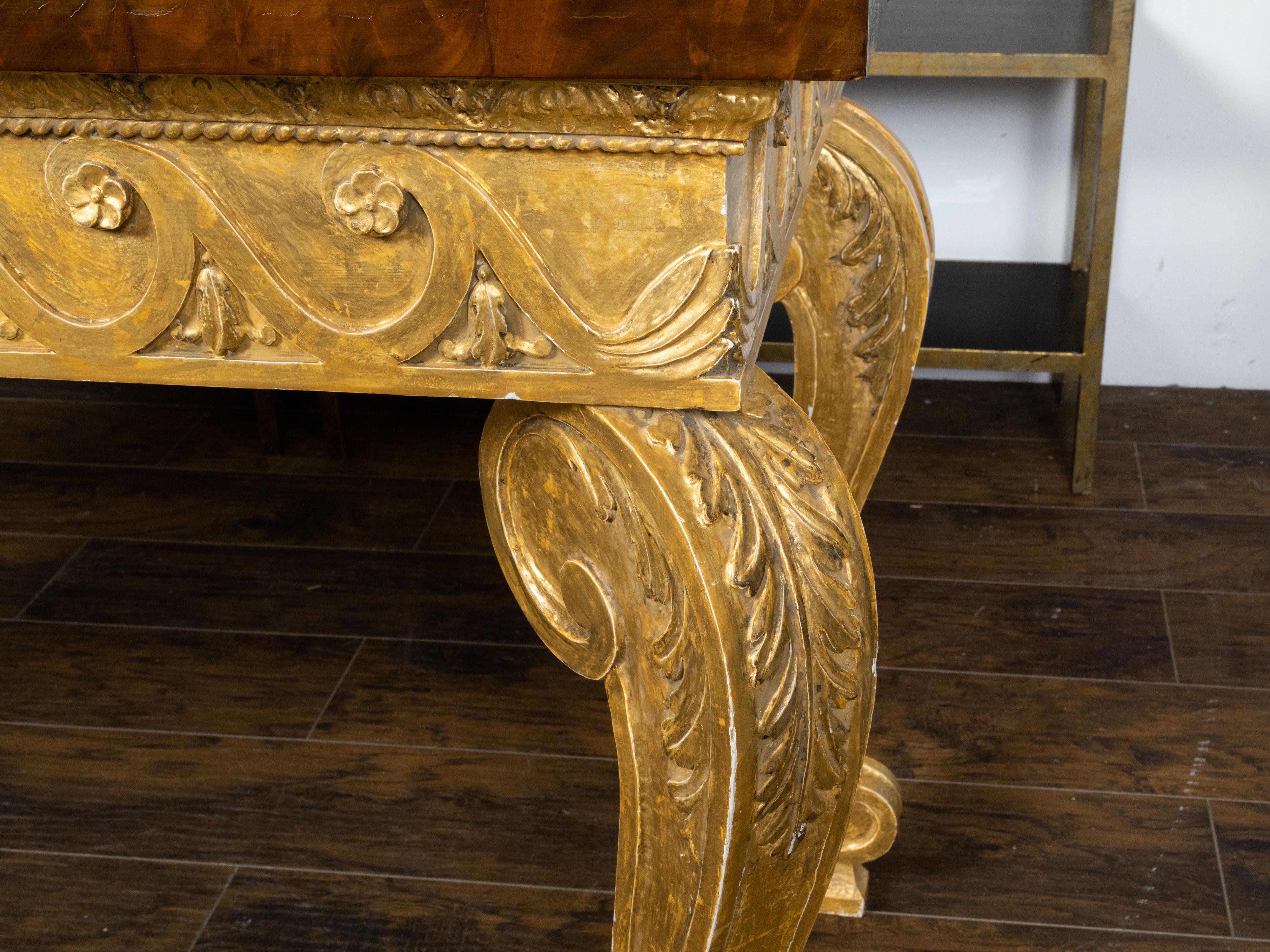 Carved English 1800s Giltwood Console Table with Mahogany Top and Vitruvian Scrolls For Sale