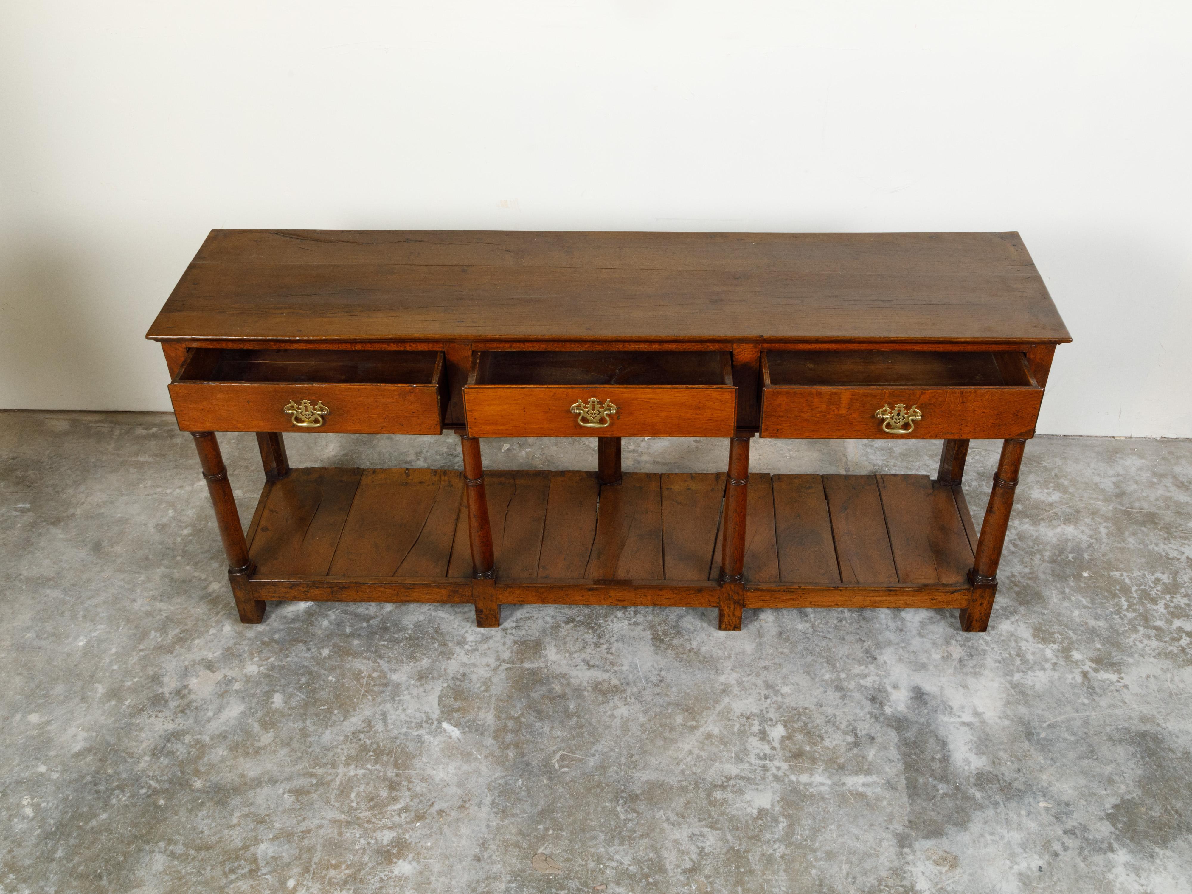 19th Century English 1820s Georgian Oak Dresser Base with Three Drawers and Pot Board Shelf