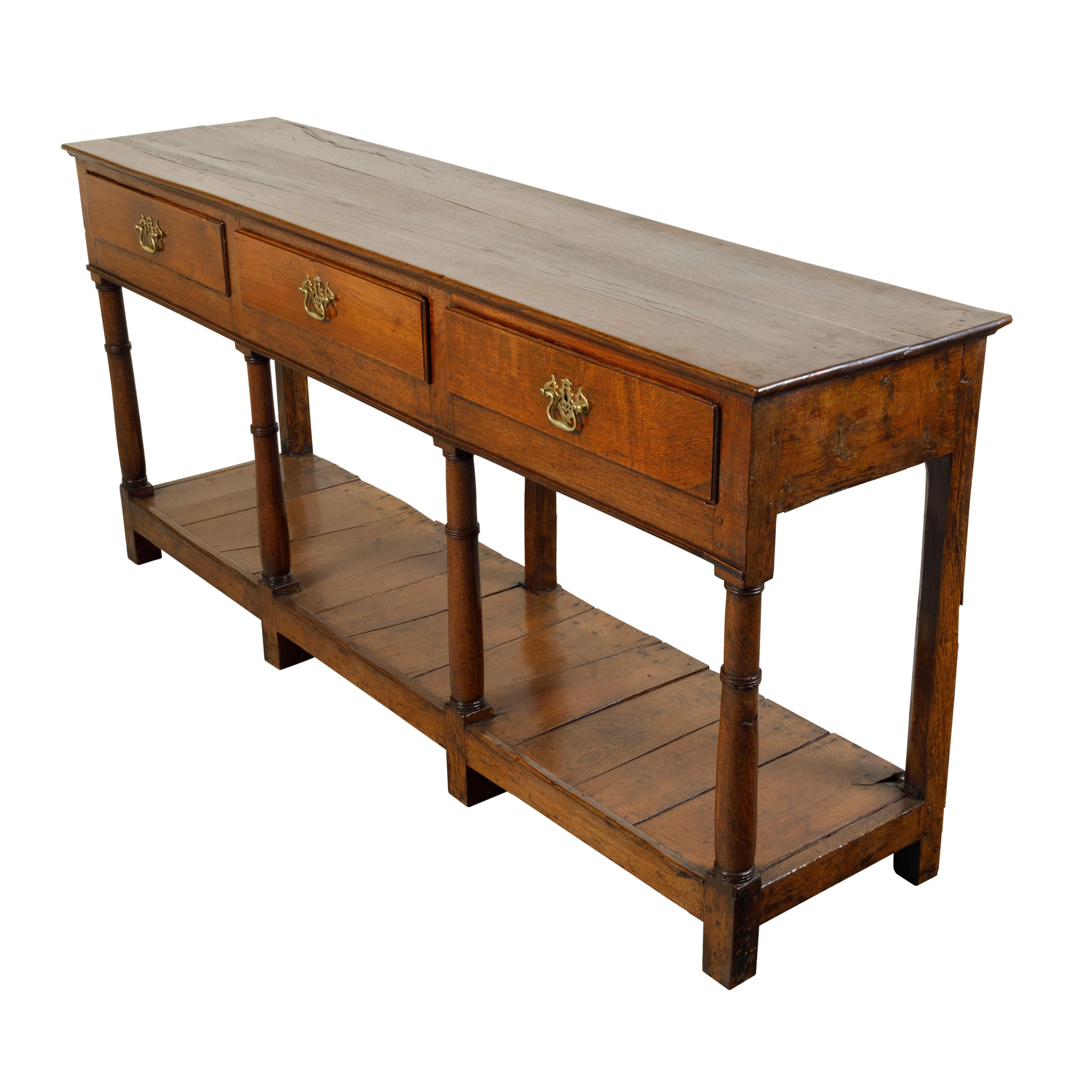 English 1820s Georgian Oak Dresser Base with Three Drawers and Pot Board Shelf