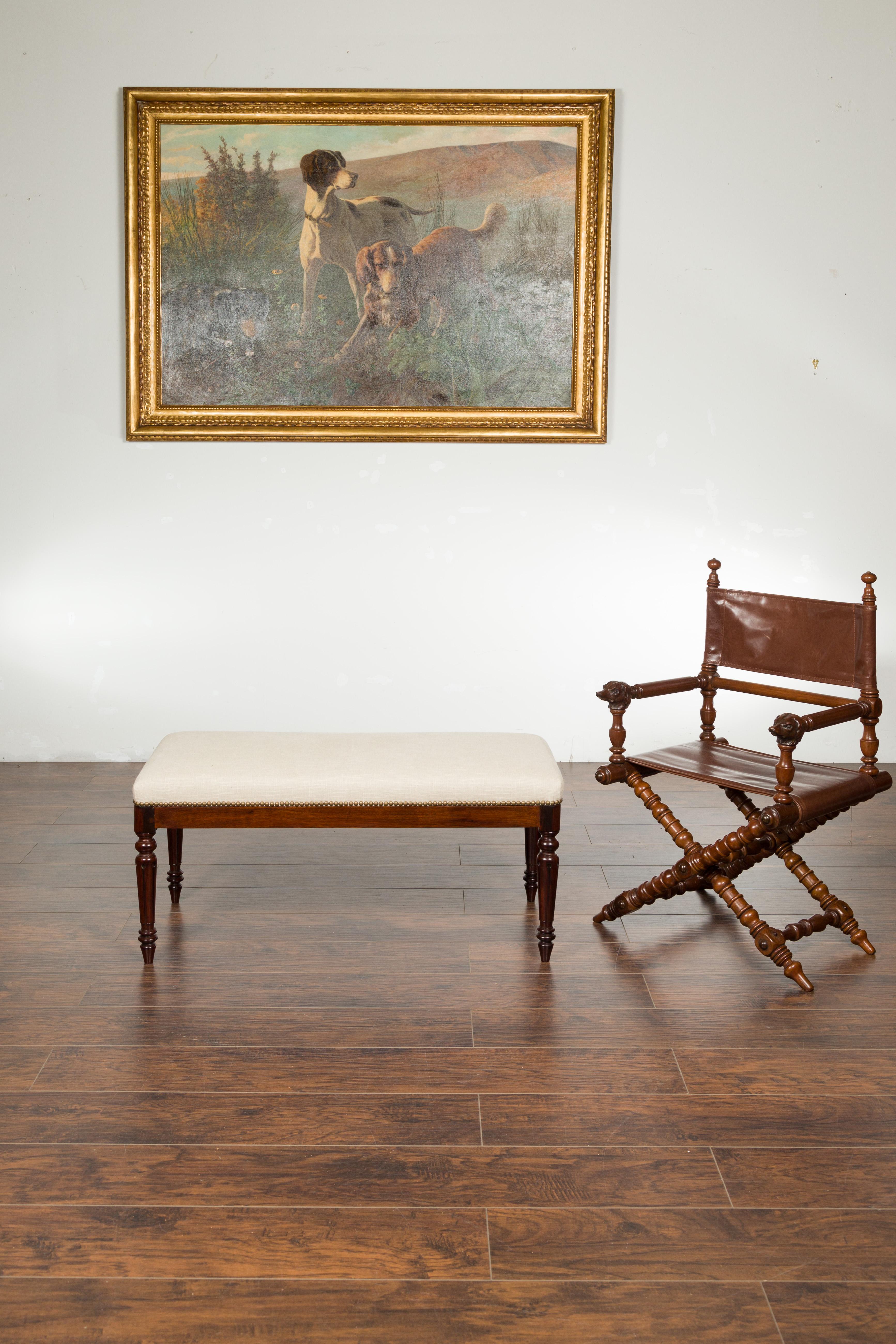 An English Georgian period rosewood bench from the early 19th century, with new upholstery and brass nailhead trim. Created in England during the first quarter of the 19th century, this Georgian rosewood bench features a rectangular seat, newly