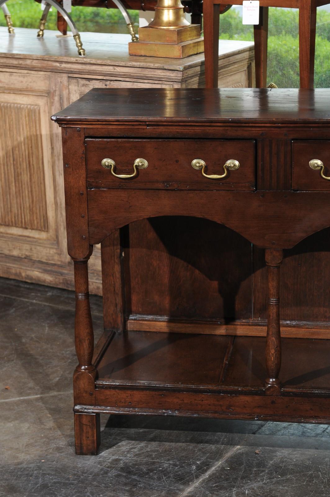 English 1820s Georgian Walnut Dresser Base with Balusters and Arched Apron In Good Condition In Atlanta, GA